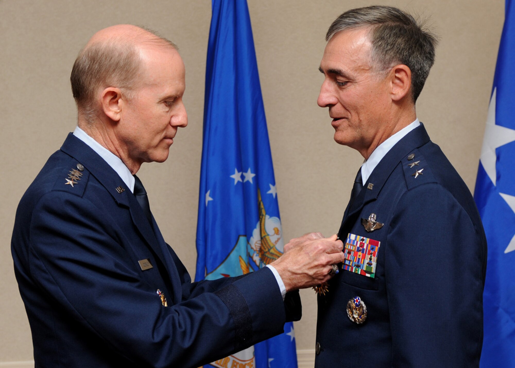 LANGLEY AIR FORCE BASE, Va. -- Maj. Gen. R. Mike Worden, Vice Commander, Air Combat Command, is presented with the Air Force Distinguished Service Medal by Gen. John D.W. Corley, Commander, Air Combat Command, during his retirement ceremony July 31. General Worden retired after 33 years of dedicated service. (U.S. Air Force photo/Amn Rebecca Montez)