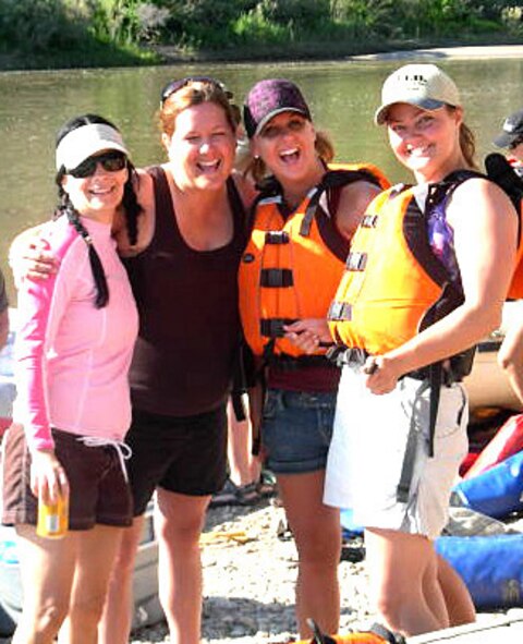 Second Lt. Janine Shreve, far right, is all smiles with friends (left to right) Nikki, Saige Davis, and Stephanie LeBeau as they prepare for their rafting trip along the the Green River in Vernal, Utah, on the Independence Day 2008 weekend.  It was during this trip that Lieutenant Shreve helped save a life, for which she  received the Air Force Commendation Medal. (Courtesy photo provided by Stephanie LeBeau)