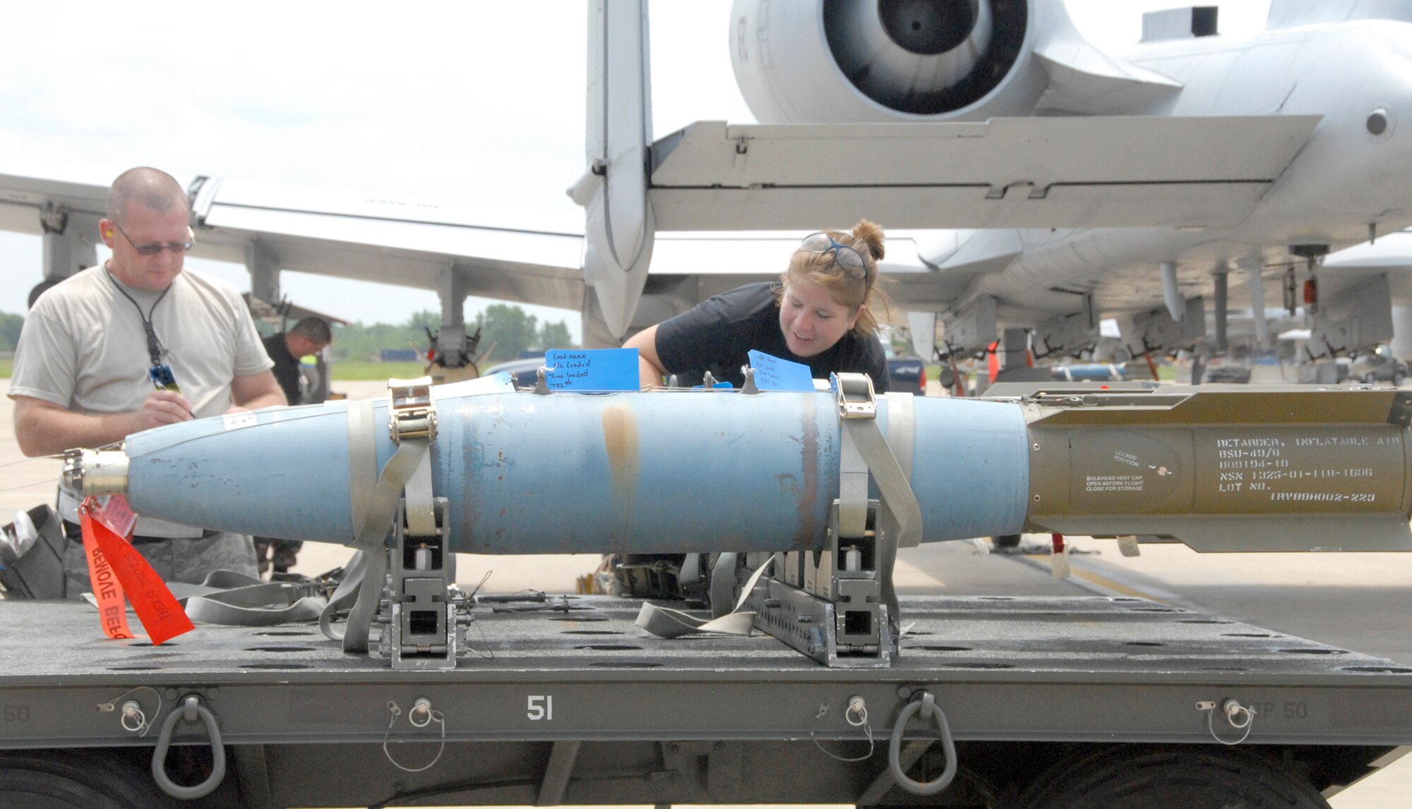 Master Sgt. Ken Temple, a munitions expeditor, and Staff Sgt. Ashley Wommack, an aircraft armament systems technician, both with the 442nd Aircraft Maintenance Squadron, prepare training munitions during a sortie surge exercise at Whiteman Air Force Base, Mo., in July 2009 in preparation for an upcoming operational readiness inspection. The 442nd AMXS is part of the 442nd Fighter Wing, an Air Force Reserve Command unit based at Whiteman.  (U.S. Air Force photo/Staff Sgt. Kent Kagarise)