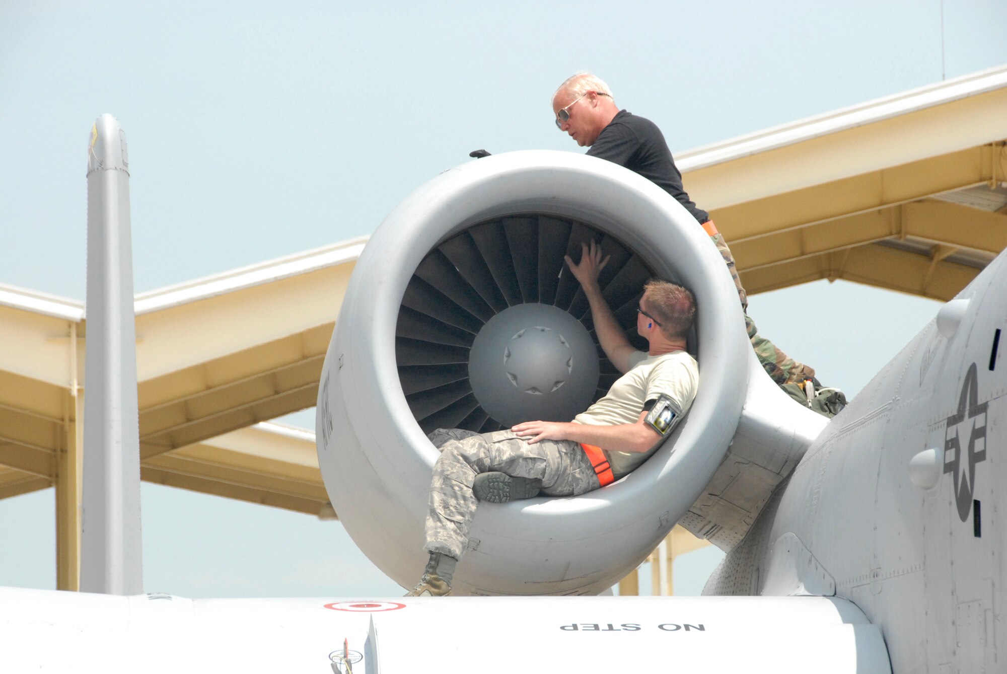 Senior Airman Kyle Brown (below) and Tech. Sgt. Dave Demma (above), both with the 442nd Aircraft Maintenance Squadron, service an A-10 Thunderbolt II following a local mission during a sortie-surge exercise at Whiteman Air Force Base, Mo., in July.  The exercise was preparation for an upcoming operational readiness inspection.  The 442nd AMXS is part of the 442nd Fighter Wing, an Air Force Reserve Command unit based at Whiteman.  (U.S. Air Force photo/Staff Sgt. Kent Kagarise)