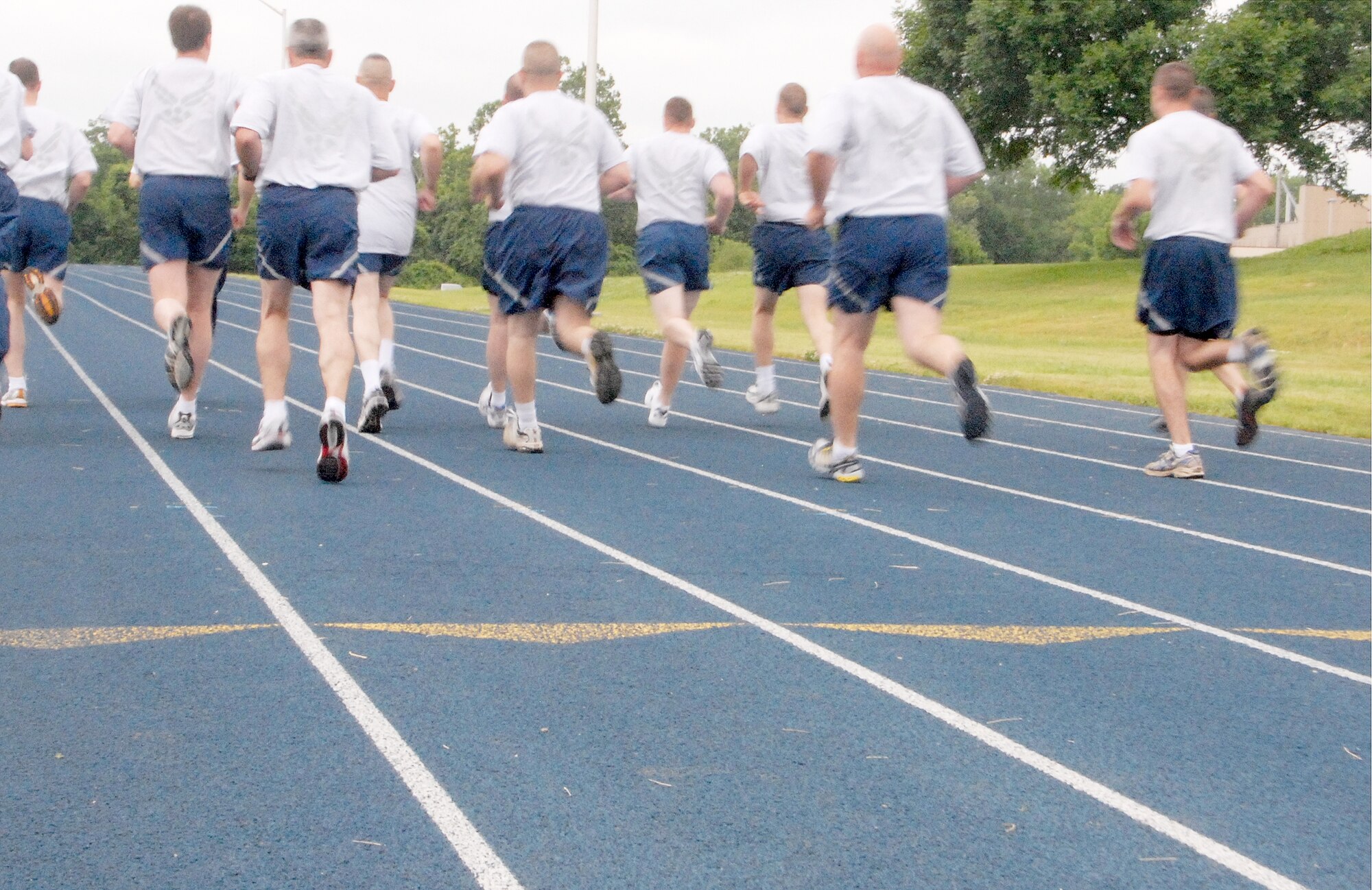 Members of the 442nd Mission Support Group perform the aerobic portion their annual fit-to-fight test on the Whiteman AFB, Mo., Fitness Center track. The 442nd MSG is part of the 442nd Fighter Wing, an Air Force Reserve Command A-10 Thunderbolt II unit based at Whiteman. (US Air Force photo/Master Sgt. Bill Huntington)