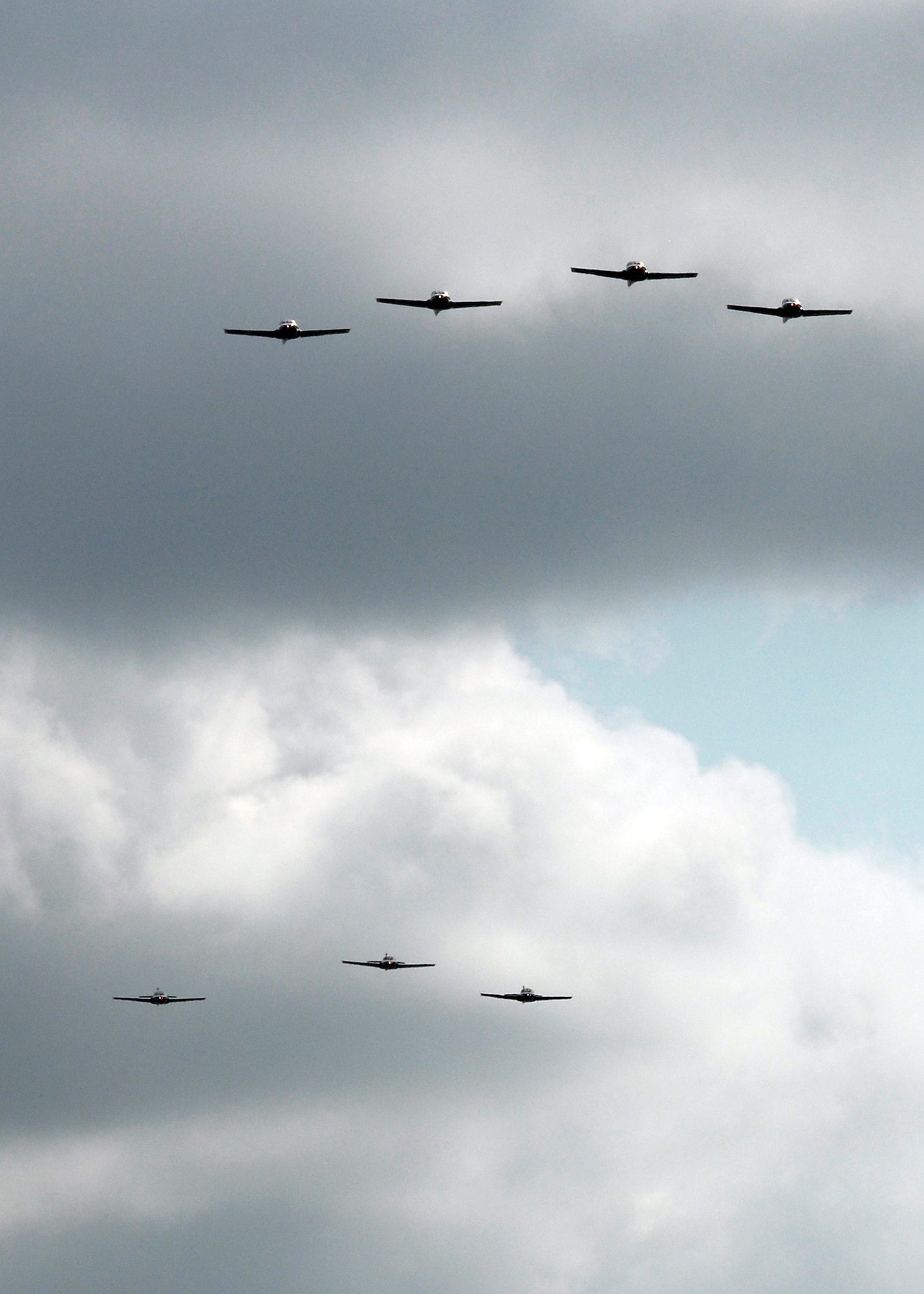 The last seven T-37B Tweets in the Air Force inventory perform flyover July 31, marking the end of the primary pilot training aircraft's more than 50 year history. More than 78,000 U.S., NATO and international pilots trained in the aircraft until the final student mission June 17. (U.S. Air Force photo/Mike Litteken)