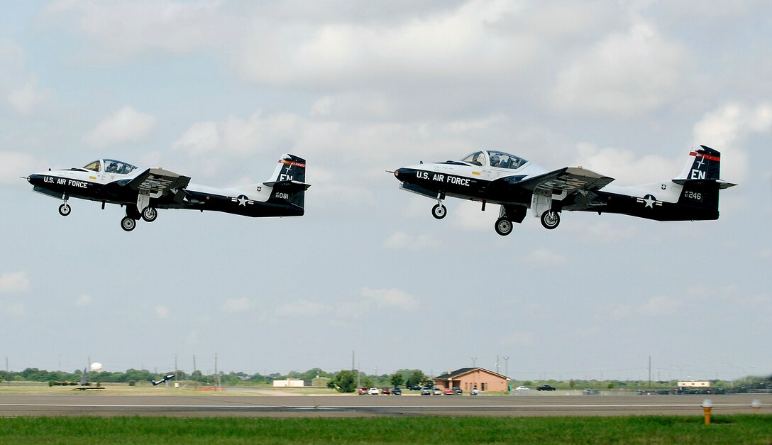 The last seven T-37B Tweets in the Air Force inventory, including the two pictured, took off for one final time July 31 as part of the aircraft's retirement ceremony. The four of the aircraft will make the journey to the Aerospace Maintenance and Regeneration Group at Davis-Monthan Air Force Base, Ariz., while the final three will go to the Utah Test and Training Range in Utah. (U.S. Air Force photo/Harry Tonemah)