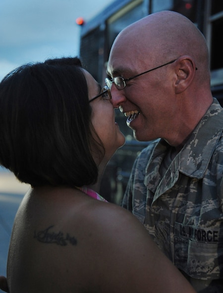 MOODY AIR FORCE BASE, Ga. -- Staff Sgt. Greg Hughes, 23rd Equipment Maintenance Squadron member from Michigan City, Ind., hugs his wife Kristina here July 30, after returning from a five-month deployment to Afghanistan. (U.S. Air Force photo by Senior Airman Gina Chiaverotti-Paige)