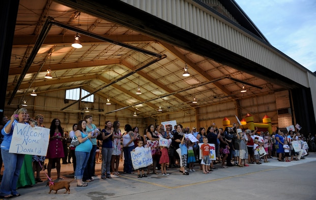 MOODY AIR FORCE BASE, Ga. -- Family and friends wait for the arrival of their loved ones returning from a deployment during a homecoming here July 30. The 74th Fighter Squadron and 74th Aircraft Maintenance Unit were deployed to Bagram Air Field, Afghanistan. (U.S. Air Force photo by Senior Airman Gina Chiaverotti-Paige)