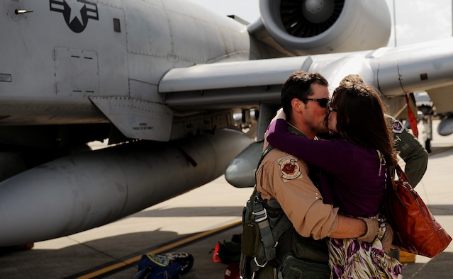 MOODY AIR FORCE BASE Ga. -- Maj. Daniel Morrisey, 74th Fighter Group assistant director of operations, kisses his wife for the first time in five months here July 30. Major Morrisey was deployed to Afghanistan in support of Operation Enduring Freedom. (U.S. Air Force photo by Airman 1st Class Joshua Green)