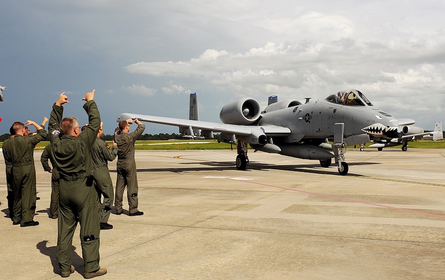 MOODY AIR FORCE BASE Ga. -- Airmen greet incoming 74th Fighter Squadron A-10C Thunderbolt II pilots here July 30. The fighter pilots are returning from a five-month deployment to Afghanistan. (U.S. Air Force photo by Airman 1st Class Joshua Green)