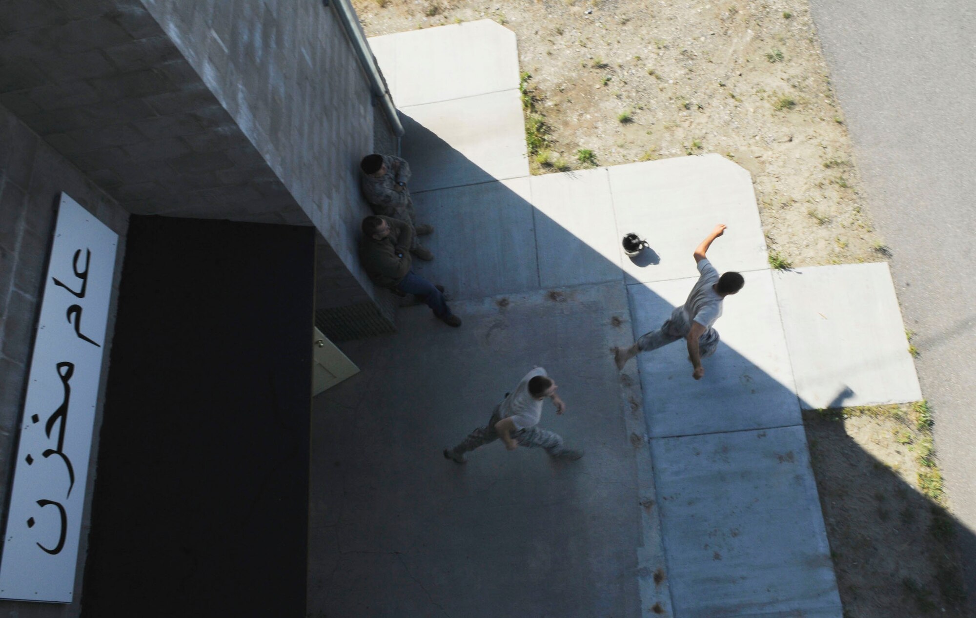 Airmen flee the building during an Active Shooter training exercise July 21, 2009, Fort Wainwright, Alaska. The exercise trains Security Forces how to neutralize threats within 90 seconds of entering a building. (U.S. Air Force photo/Airman 1st Class Laura Goodgame)