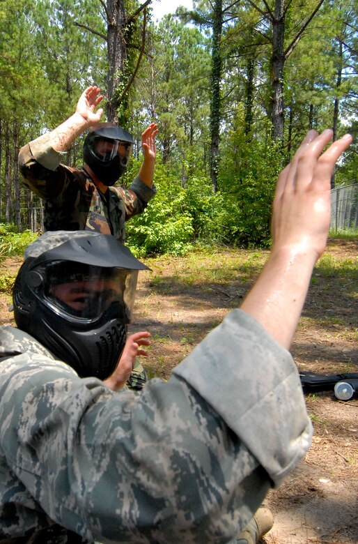 New second lieutenants attending Maxwell's Air and Space Basic Course are shown in different phases of field training on Lake Jordan as part of Vigilant Warrior. Learning the skills to operate in an expeditionary environment, they are armed with "simulated M-4 marker sets," or paint guns and learn land navigation, small unit tactics and integrated base defense. (U.S. Air Force photo/Donna Burnett)