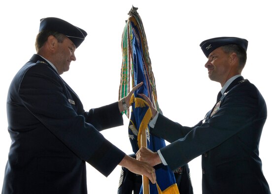 U.S. Air Force Col. Mark Dillon accepts the guidon from Lt. Gen. Philip Breedlove, 3rd Air Force commander, during the 86th Airlift Wing change of command ceremony on Ramstein, July 31, 2009. (U.S. Air Force photo by Staff Sgt. Stephen Otero)