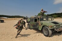 Security forces students exit a Humvee during basic combat convoy field training at Camp Bullis. Camp Bullis, a training camp located in northwest San Antonio, is used primarily as maneuvering grounds for Army, Air Force and Marine combat units. (U.S. Air Force photo/Patrick Nugent) 