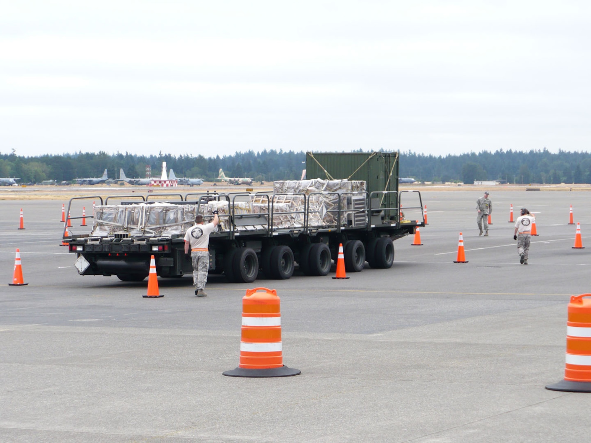 The 435th Contingency Response Group’s Aerial Port team maneuvers a 60K Tunner Loader through an obstacle course as part of the Air Mobility Command Rodeo 2009 competition at McChord Air Force Base, Wash. More than 50 Airmen from Team Ramstein were part of the 2,500 servicemembers from around the Air Force and the globe participating in the rodeo. The competition, which went from Jul 19 to 24, is a bi-annual mobility readiness exercises that brings teams together to compete in more than 50 judged events spanning the categories of aerial port, aeromedical evacuation, aircrew, fit to fight, maintenance and security forces.  (Courtesy photo)