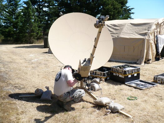 Tech. Sgt Wade Stewart of the 435th Contingency Response Group disassembles a Small Portable Initial Communications Equipment, commonly known as SPICE, satellite antenna during the Air Mobility Command Rodeo 2009 competition at McChord Air Force Base, Wash.  More than 50 Airmen from Team Ramstein were part of the 2,500 servicemembers from around the Air Force and the globe participating in the rodeo. The competition, which went from Jul 19 to 24, is a bi-annual mobility readiness exercises that brings teams together to compete in more than 50 judged events spanning the categories of aerial port, aeromedical evacuation, aircrew, fit to fight, maintenance and security forces.  (Courtesy photo)