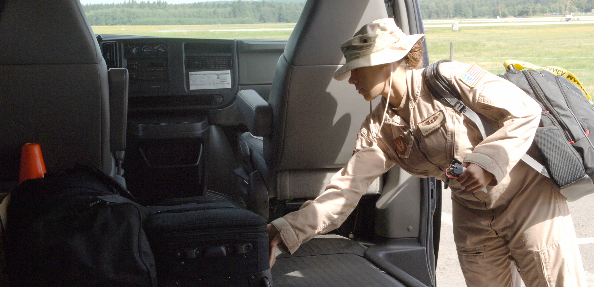 U.S. Air Force Staff Sgt. Bianca Martin, 76th Airlift Squadron flight attendant, loads her luggage onto a van in preparation for a mission, July 28, 2009, Ramstein Air Base, Germany. The 76th AS performs operational support airlift missions in Europe. (U.S. Air Force photo by Senior Airman Amanda Dick)