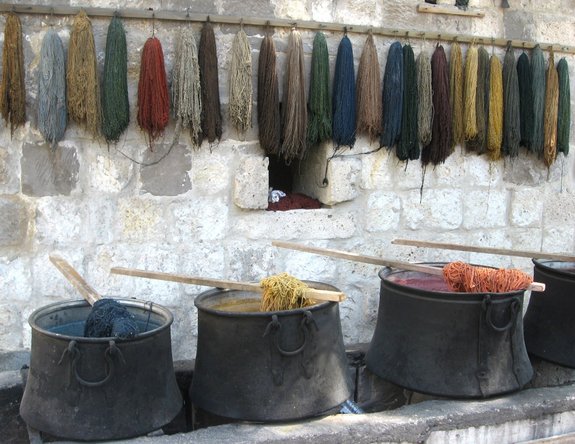 Wool is dyed in different colors made from color extracted from flowers, roots and insects for hours before it is hung to dry. Natural materials are more durable than synthetic materials so good quality Turkish rugs are made from the finest silk, bred sheep and naturally picked cotton. (U.S. Air Force photo/Airman 1st Class Amber Ashcraft)