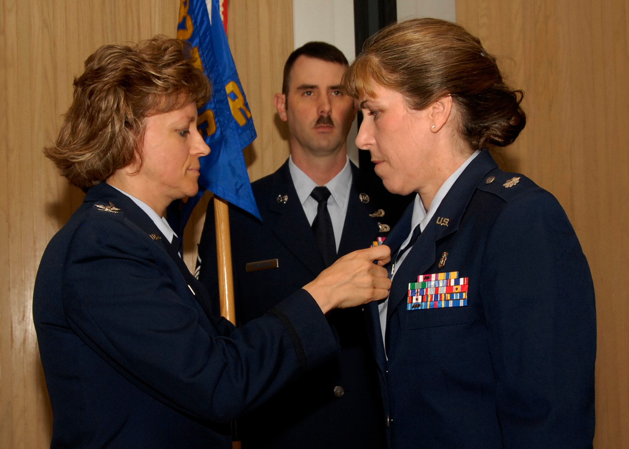 Commander of the 882nd Training Group Col. Nancy Dezell and  Lt. Col. Patricia Welch, incoming 382nd Training Squadron commander, perform the squadron's change of command ceremony June 1 in Bldg. 1900. (U.S. Air Force photo/Harry Tonemah)
