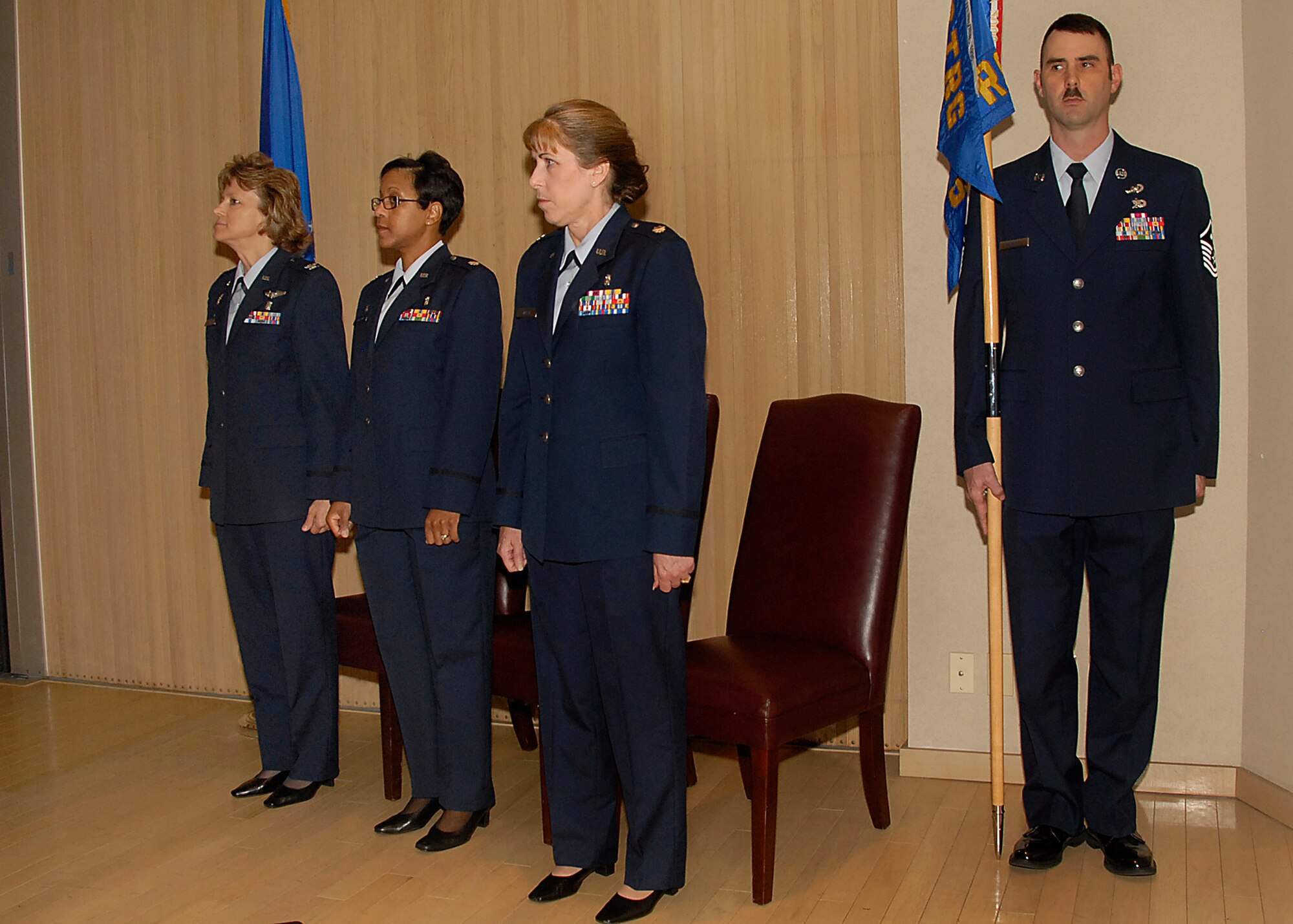 Commander of the 882nd Training Group Col. Nancy Dezell, Lt. Col. Subrina Linscomb, outgoing 382nd Training Squadron commander, and  Lt. Col. Patricia Welch, incoming 382nd TRS commander, perform the squadron's change of command ceremony June 1 in Bldg. 1900. (U.S. Air Force photo/Harry Tonemah)