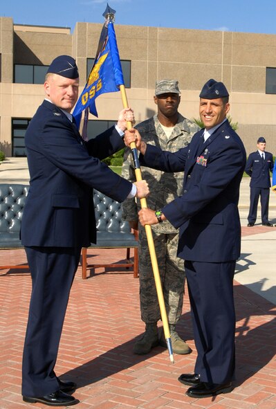 LAUGHLIN AIR FORCE BASE, Texas – Lt. Col. Michael Brockey receives the 47th Operations Support Squadron guidon from Col. Martin Schans, 47th Operations Group commander, during a change of command ceremony here June 1. Colonel Brockey was previously the director of operations for the 47th OSS and is a command pilot with more than 3,300 flight hours. (U.S. Air Force photo by Jose Mendoza)