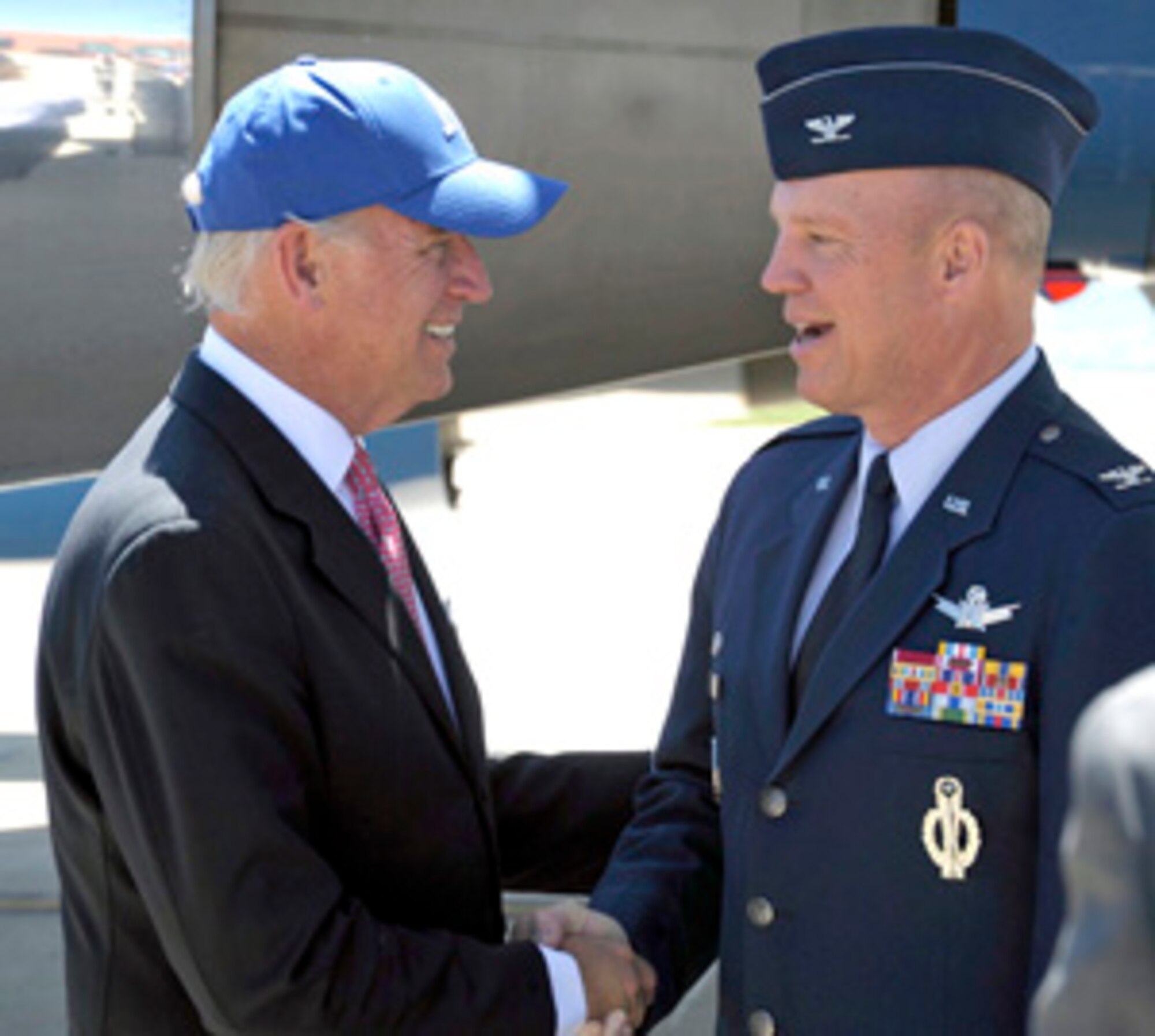 Vice President Joe Biden chats with Col. Jay Raymond, 21st Space Wing commander, on the Peterson flightline May 27. The vice president arrived in Colorado to give the United States Air Force Academy commencement speech to the 51st class consisting of approximately 1,040 cadets. Vice President Biden arrived at Peterson May 26 and departed after the graduation May 27. (Photo courtesy of the United States Air Force) 