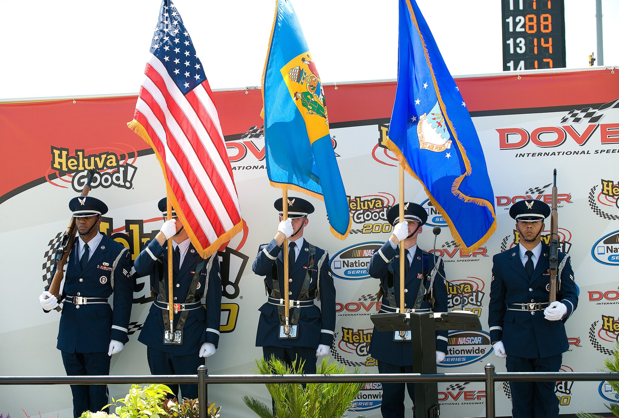 An honor guard team, assigned to Dover Air Force Base, Del., posted the colors as part of a pre-race ceremony at the Dover International Speedway May 30. The base's honor guard and chaplain were both broadcast on national television. Over the race weekend May 30-31, reservists and regular Air Force members from the 512th and 436th Airlift Wings participated in various events showcasing Air Force and AF Reserve capabilities in a 135,000-person arena. (Air Force photo/Jason Minto)