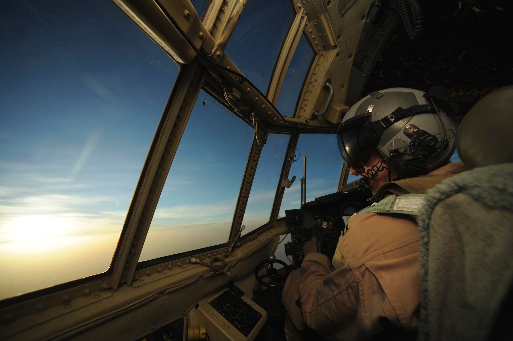 Capt. Kenneth Hoekman scans the horizon during aeromedical operations from a C-130 Hercules April 23 over Southwest Asia. Captain Hoekman is a C-130 pilot from the 746th Expeditionary Airlift Squadron. (U.S. Air Force photo/Staff Sgt. James L. Harper Jr.) 
