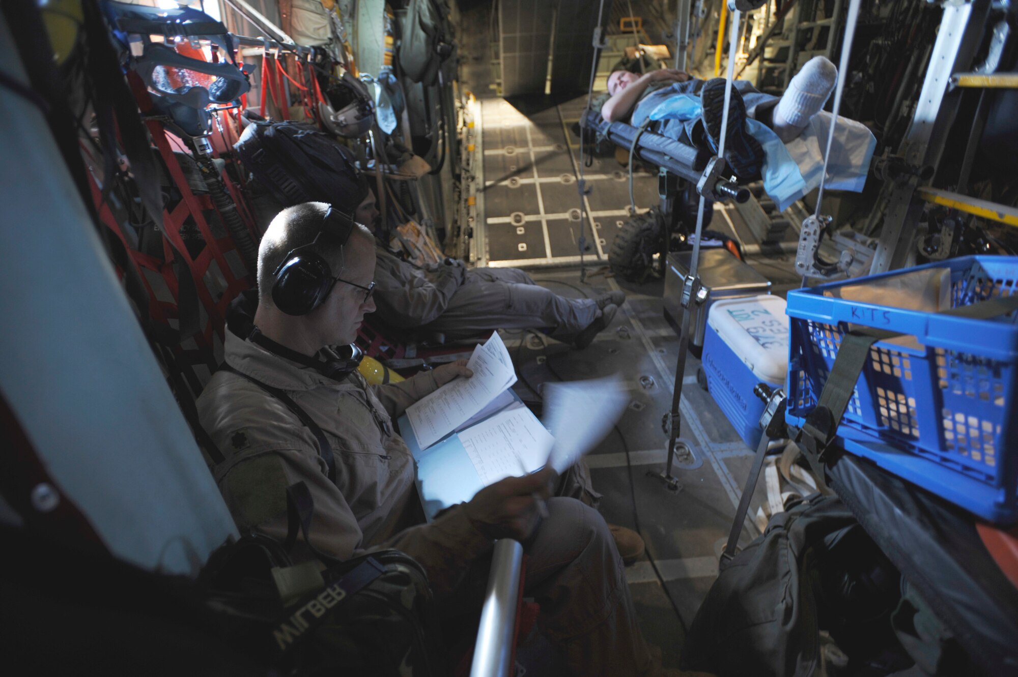 Maj. Scott Wilber reviews medical records during aeromedical operations April 23 over Southwest Asia. Major Wilber is a flight nurse from the 379th Expeditionary Aeromedical Evacuation Squadron. (U.S. Air Force photo/Staff Sgt. James L. Harper Jr.) 
