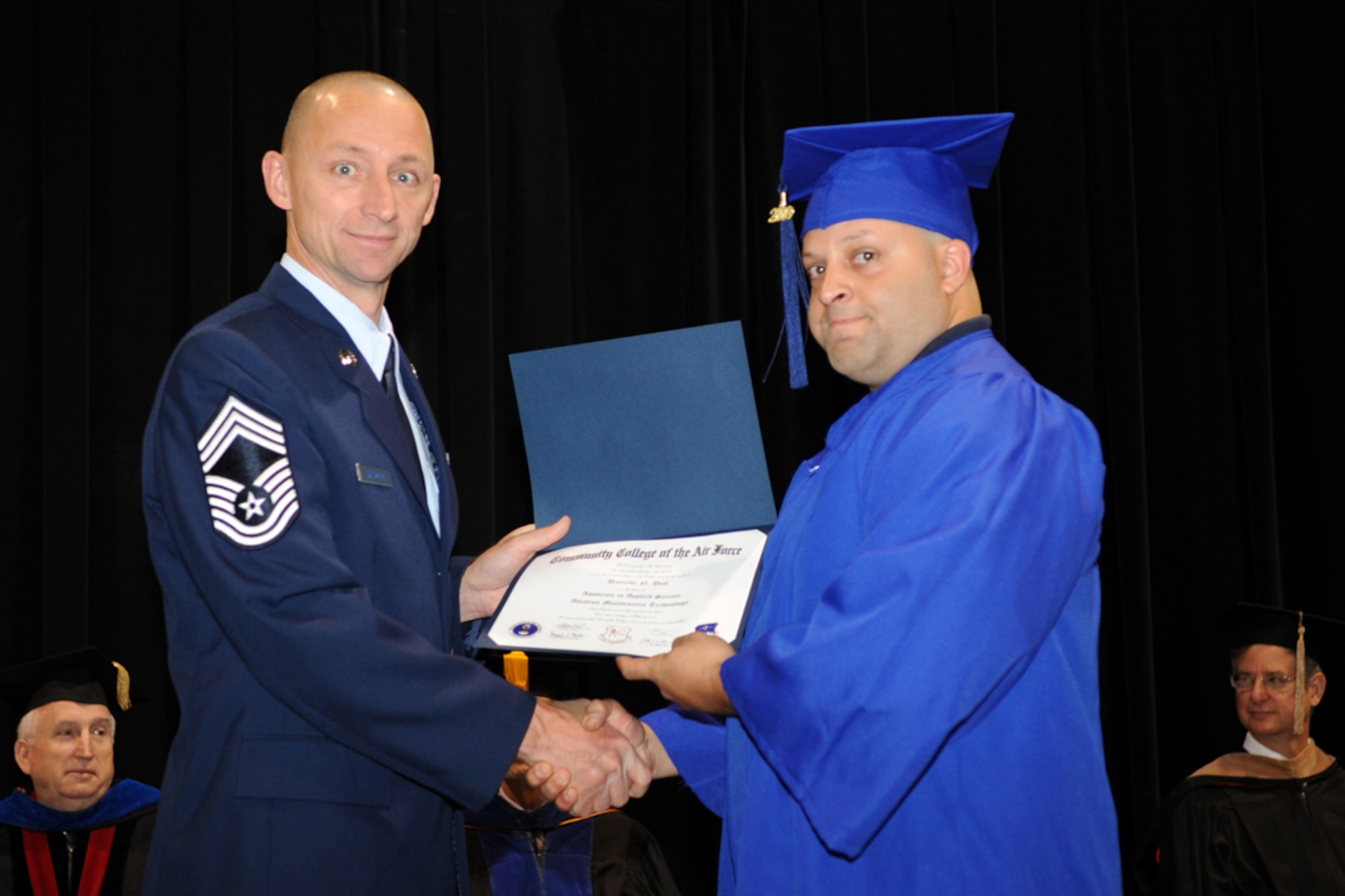 Staff Sgt. Danielle Dial, 917 Maintenance Squadron, journeyman aircraft mechanic, receives his Associate Degree in Applied Science Aviation Maintenance Technology from the Community College of the Air Force during ceremonies May 28, 2009. Sergeant Dial is also the 917th Wing’s Pitsenbarger Award recipient. The Air Force Association, through its education subsidiary, the Aerospace Education Foundation, a wards the grant in memory of Airman 1st Class William H. Pitsenbarger, the Air Force’s second Medal of Honor recipient since becoming a separate service in 1947. A1C Pitsenbarger was a pararescue medic who participated in more than 300 rescue missions during the Vietnam War. (U.S. Air Force photo/Senior Airman Ryan Ivacic)