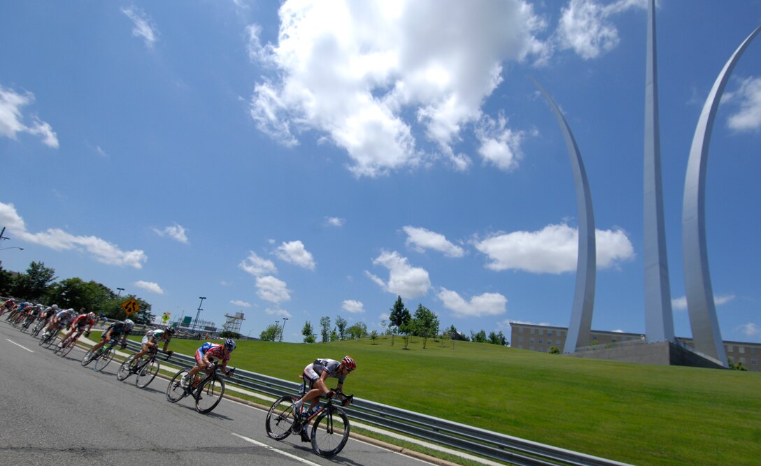 Riders pass the Air Force Memorial in Arlington, Va May 30, 2009 prior to the start of their race during the 2009 Air Force Cycling Classic in Crystal City, Va.  More than 950 people participated in the annual bicycling event, raising $34,500 for the Fallen Heroes Fund. (U.S. Air Force photo by Senior Airman Tim Chacon)