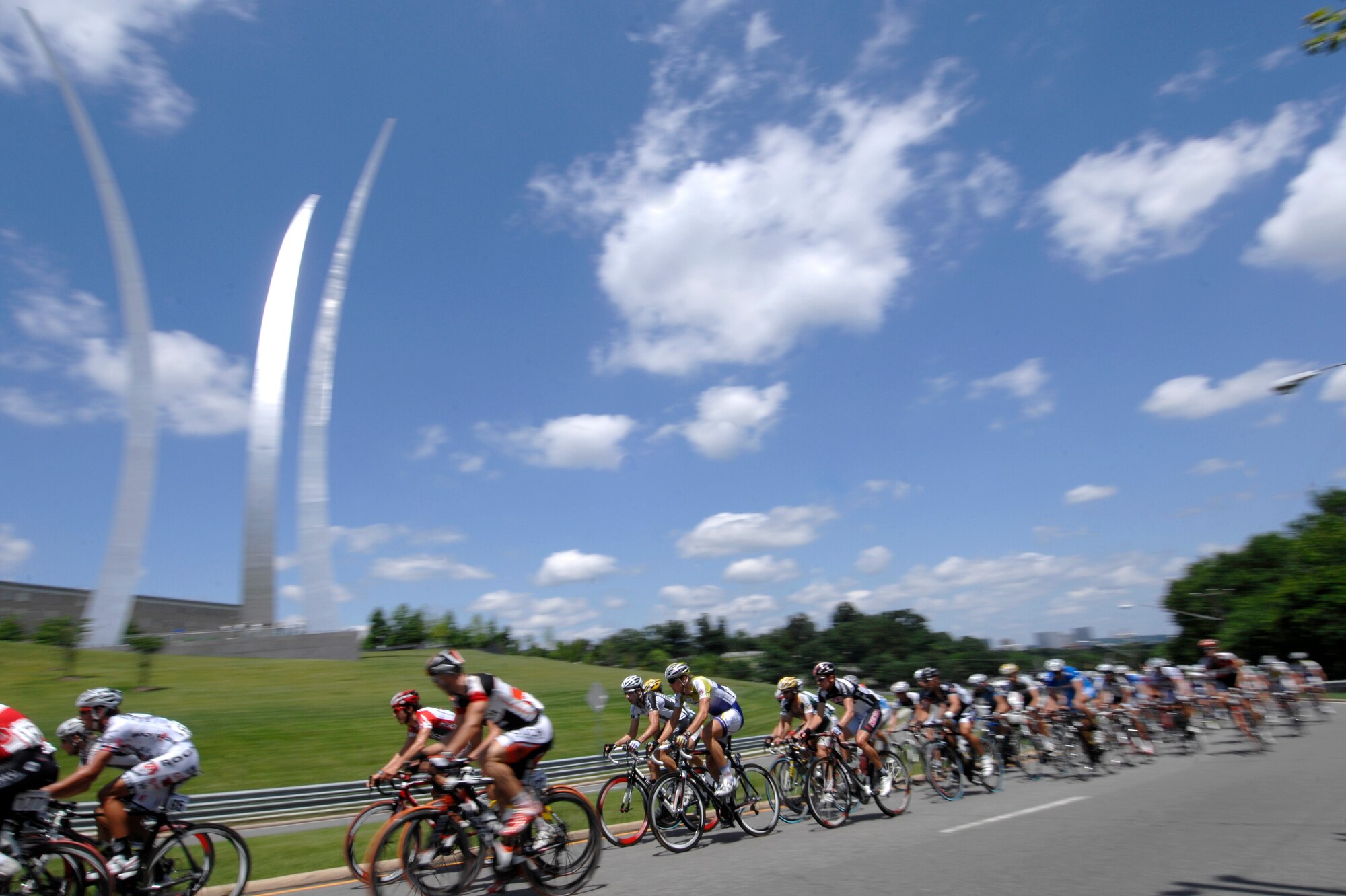 Riders pass the Air Force Memorial in Arlington, Va May 30, 2009 prior to the start of their race during the 2009 Air Force Cycling Classic in Crystal City, Va.  More than 950 people participated in the annual bicycling event, raising $34,500 for the Fallen Heroes Fund. (U.S. Air Force photo by Senior Airman Tim Chacon)