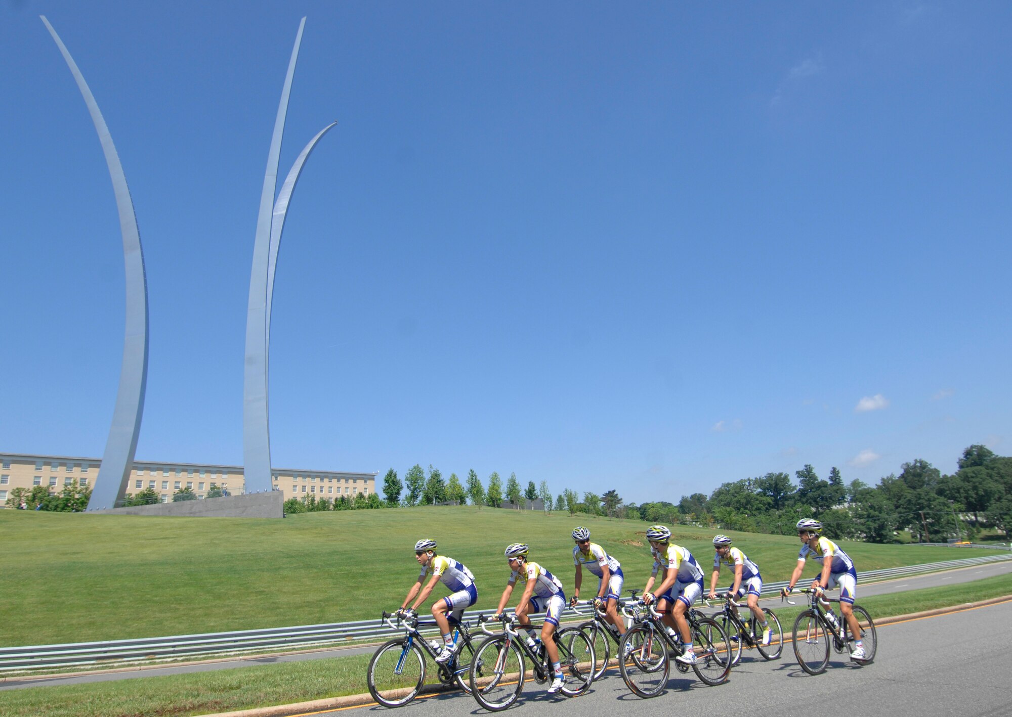 Riders pass the Air Force Memorial in Arlington, Va May 30, 2009 prior to the start of their race during the 2009 Air Force Cycling Classic in Crystal City, Va.  More than 950 people participated in the annual bicycling event, raising $34,500 for the Fallen Heroes Fund. (U.S. Air Force photo by Senior Airman Tim Chacon)