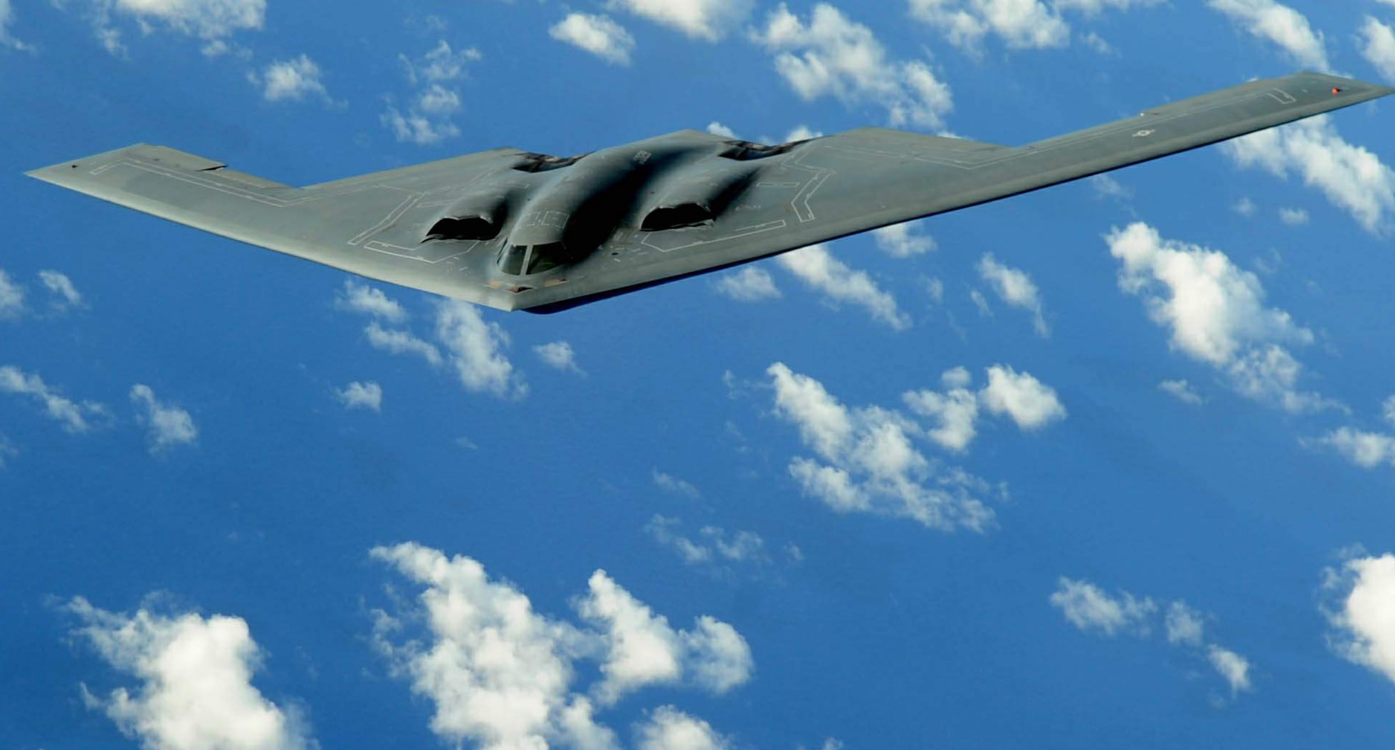 A B-2 Spirit deployed to Andersen Air Force Base, Guam, flies a training mission over the Pacific in support of the continuous bomber presence. This bomber was one of four aircraft to complete 700 flying hours during the three-month deployment from Whiteman Air Force Base, Mo. (U.S. Air Force photo/Senior Airman Christopher Bush) 
