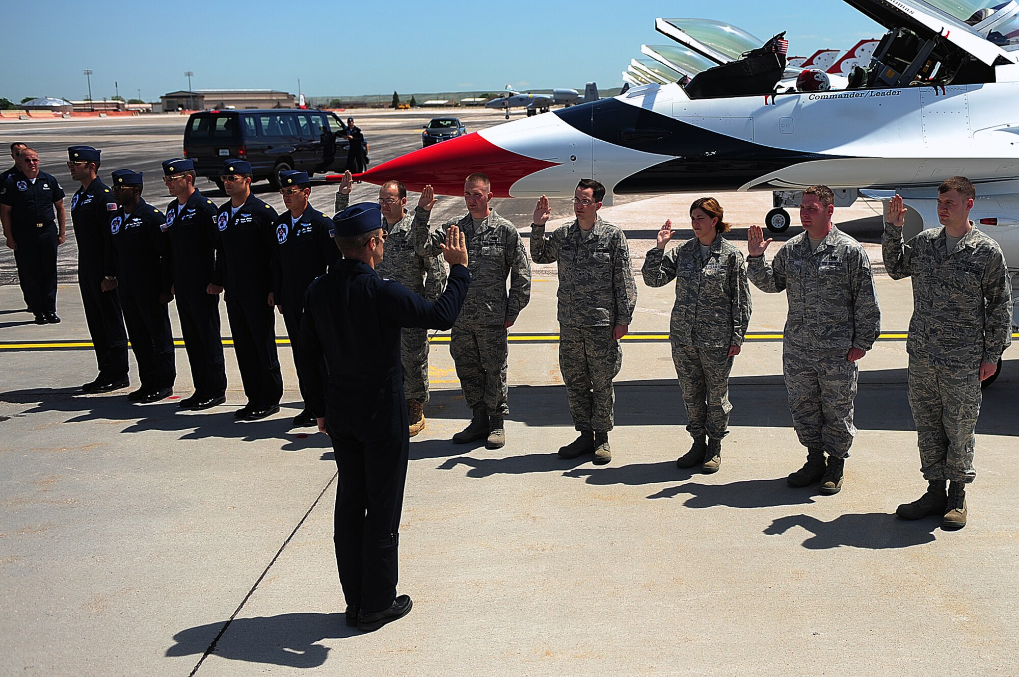 Airmen are reenlisted in the United States Air Force by Lt. Col. Greg Thomas, Thunderbirds commander here, May 29.  The six Airmen who were reenlisted were congratulated by members of the Thunderbirds after the ceremony. (U.S. Air Force photo/Airman 1st Class Joshua J. Seybert)

