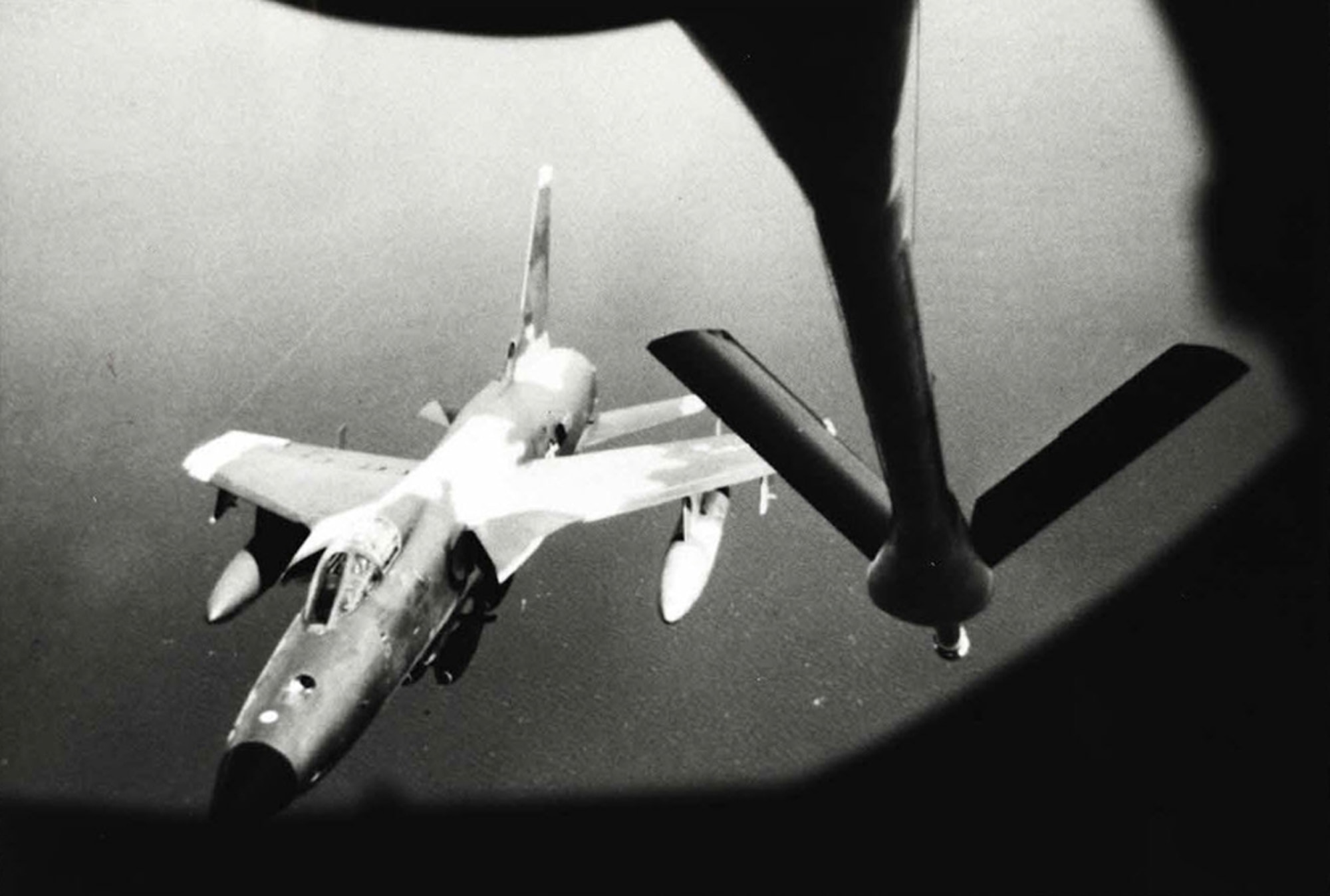 F-105 Thunderchiefs carried the brunt of the early air war in Vietnam, and benefitted from some of the most spectacular tanker ?saves.?  Here, a bomb-laden F-105D is about to refuel over the Gulf of Tonkin.