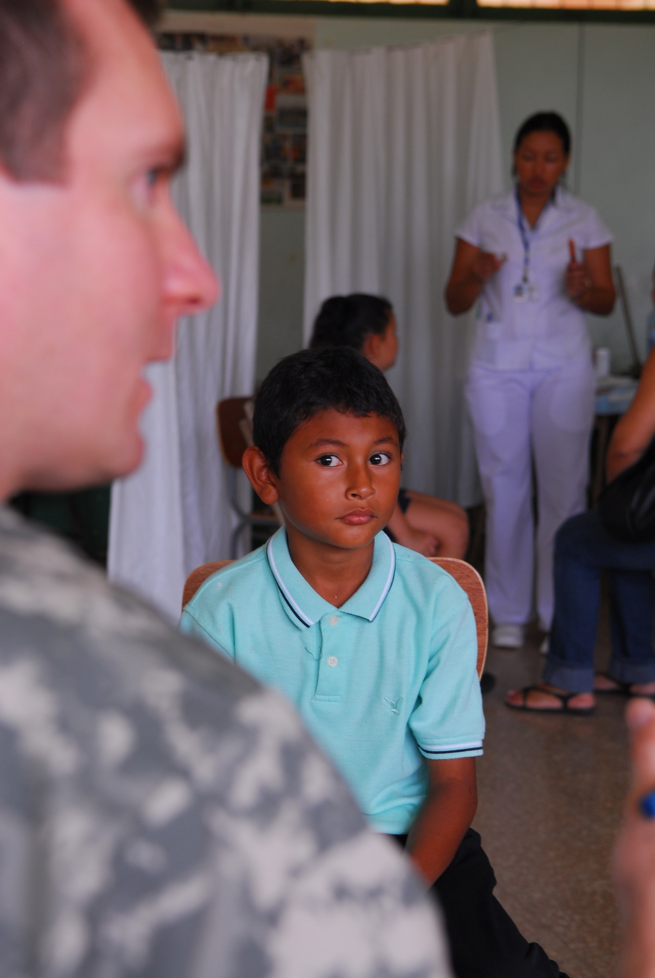 SANTA ROSA, Costa Rica – A local resident here awaits treatment from Capt. Michael Riggall, a 30th Medical Operations Squadron pediatrician, May 23. Medical personnel from the 30th Space Wing deployed to Costa Rica May 16 - 30 as part of a humanitarian effort with local Costa Rican physicians. Medical specialists from both countries provided medical care to residents who are rarely seen by physicians due to living in isolated areas.(U.S. Air Force photo/Airman 1st Class Steve Bauer)