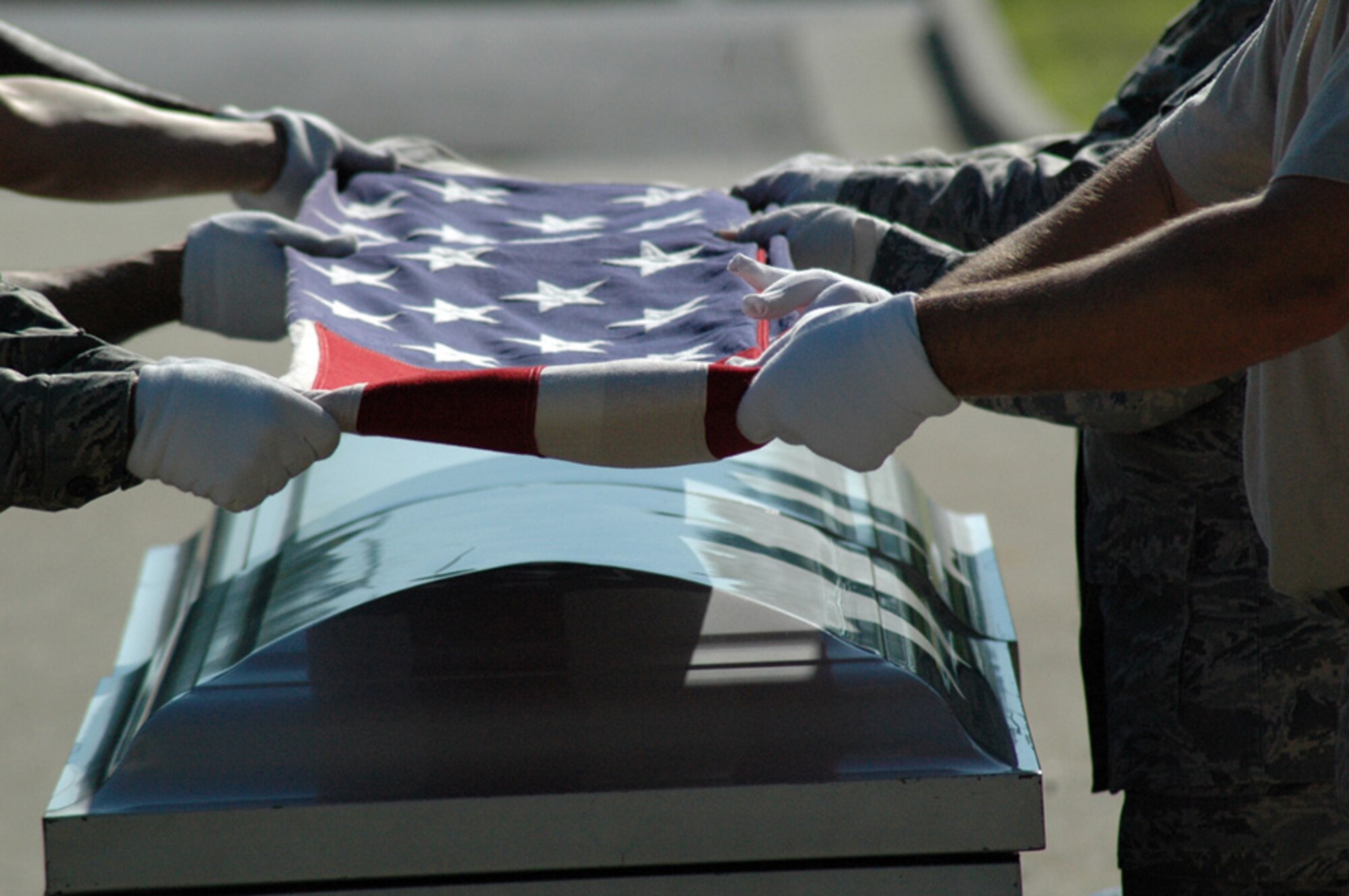 DOBBINS AIR RESERVE BASE, Ga. -- 94th Airlift Wing Honor Guard members practice folding the American flag during a mock funeral June 1. To join the Honor Guard contact Master Sgt. Bruce See at 678- 655-5272. (U.S. Air Force photo/Erin Tindell)