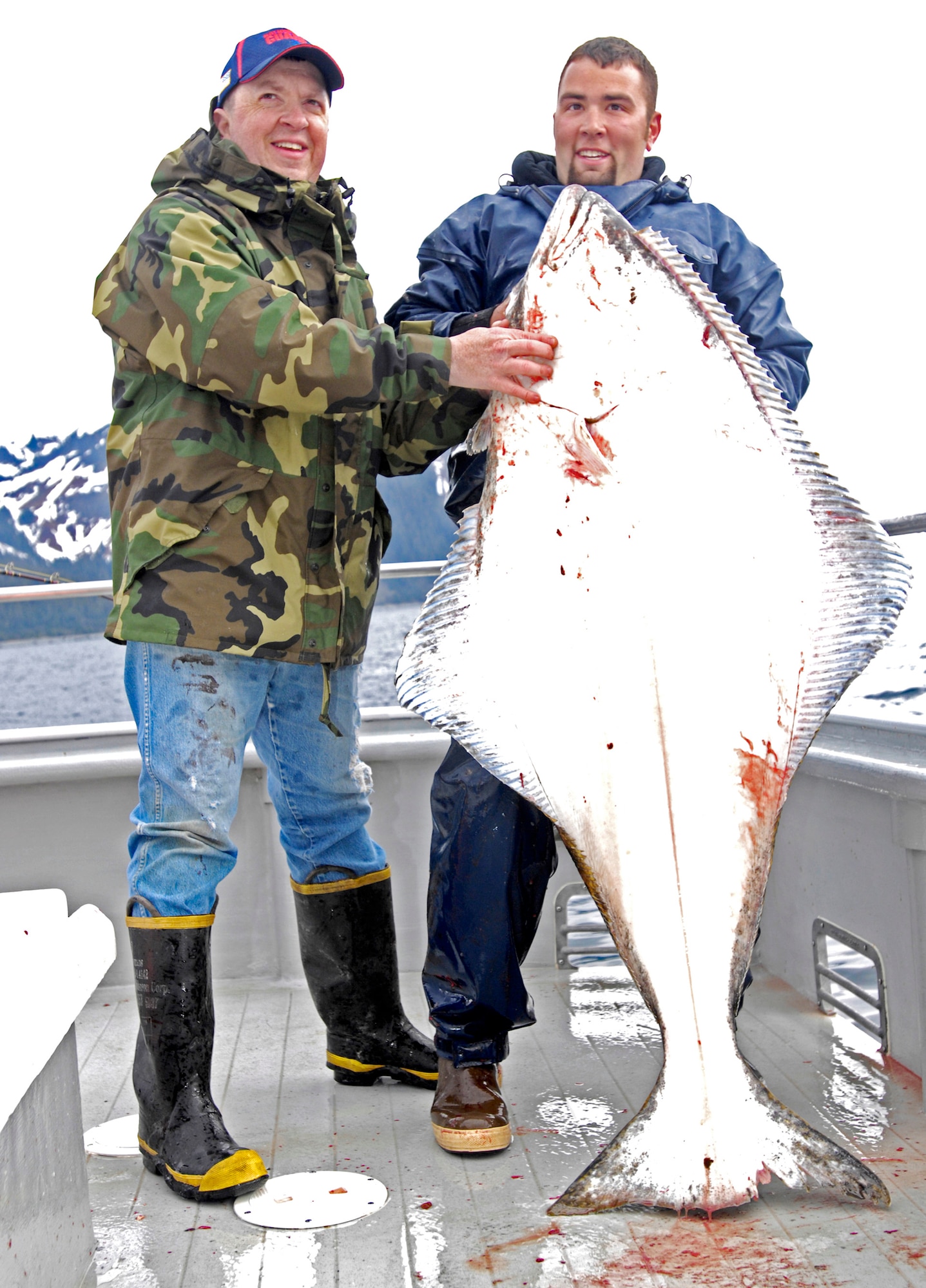 Duane Middleton with deck hand Jeff Eide shows the 90-pound halibut he caught May 21 in Seward, Alaska. Mr. Middleton is part of the Alaska Army National Guard and was deployed to Kuwait from July 2006 to November 2007. The tournament, sponsored by the Armed Services YMCA and the Seward Charter Association, is a free day of halibut charter fishing mainly for veterans of the Iraq and Afghanistan wars. (U.S. Air Force photo/Airman 1st Class Christopher Gross) 
