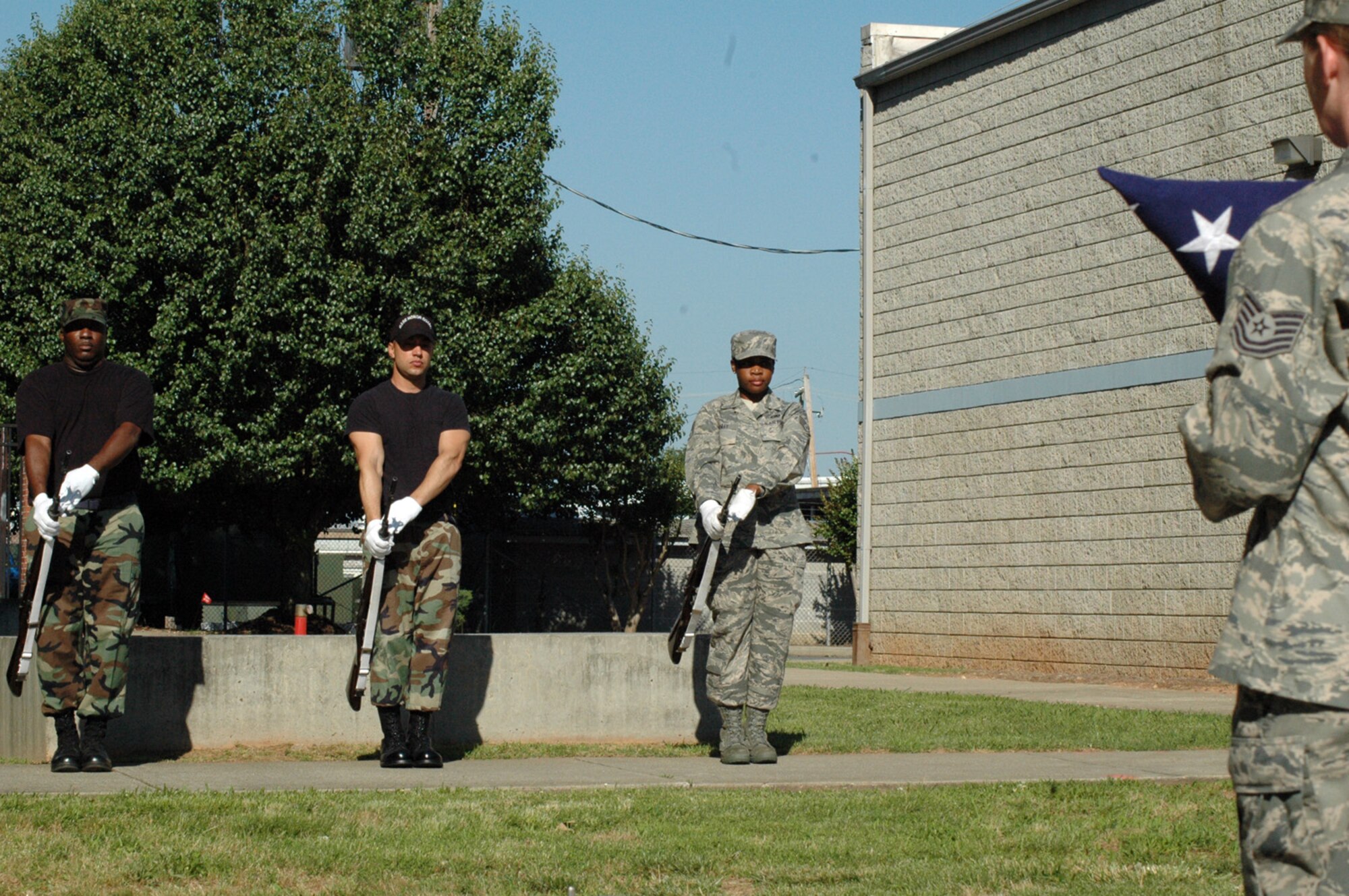 DOBBINS AIR RESERVE BASE, Ga. -- 94th Airlift Wing Honor Guard members present arms during a mock funeral June 1. To join the Honor Guard contact Master Sgt. Bruce See at 678-655-5272. (U.S. Air Force photo/Kennith Green)