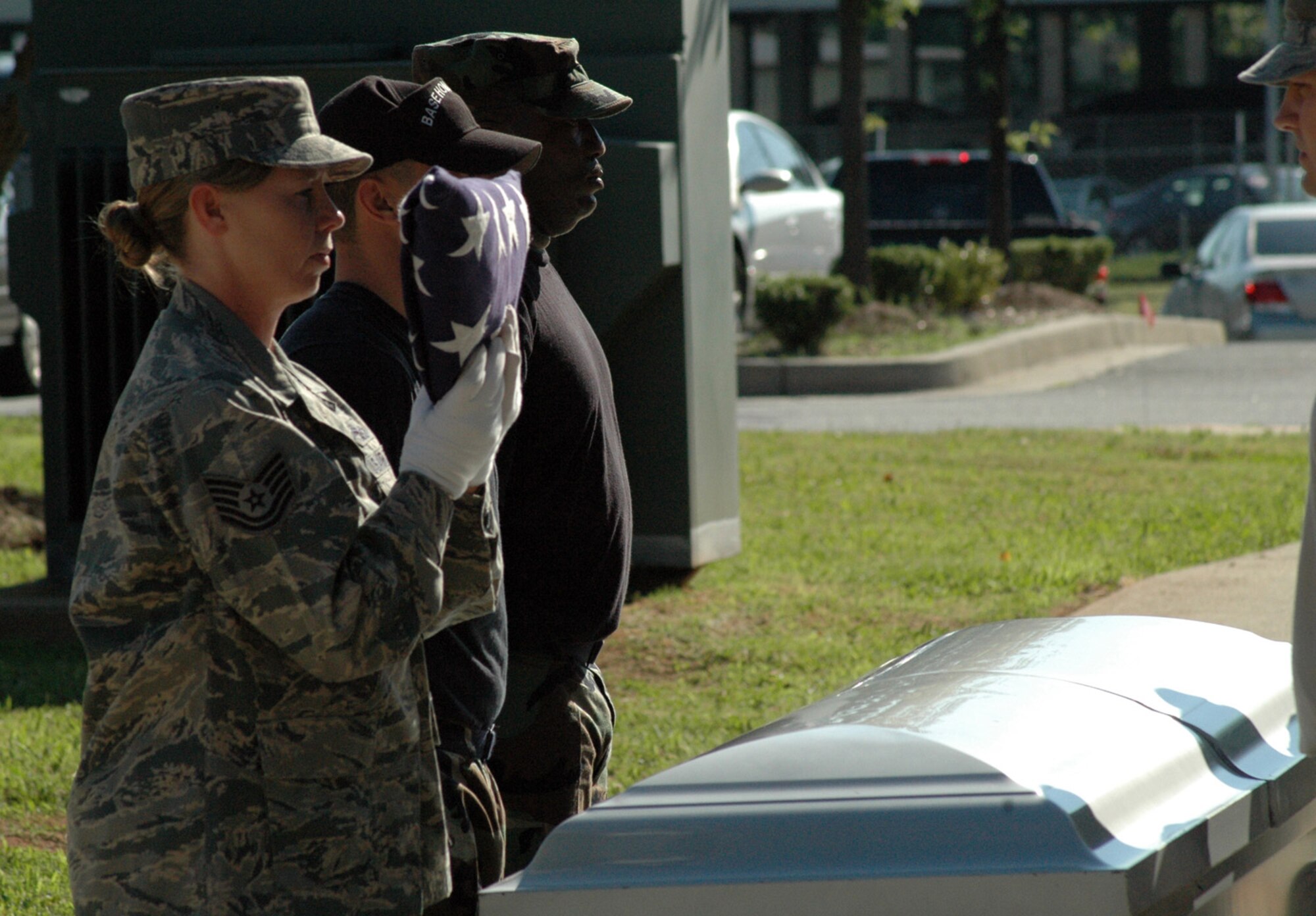 DOBBINS AIR RESERVE BASE, Ga. -- Tech Sgt. Lisa Whitley, 94th Airlift Wing Honor Guard, presents a folded flag during a mock funeral June 1. To join the Honor Guard contact  Master Sgt. Bruce See at 678-655- 5272.