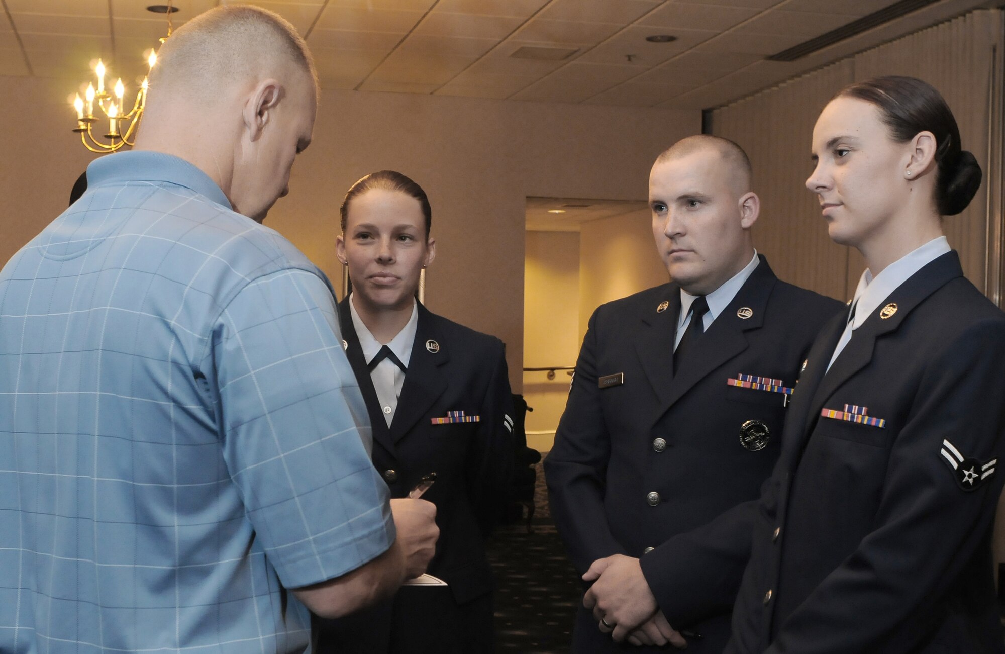 Chief Master Sgt. Jim Roy speaks with Airmen after a Chief Master Sergeant of the Air Force Room dedication ceremony May 26 at the Bolling Club at Bolling Air Force Base, D.C. The room was dedicated to honor the Air Force's highest enlisted position and provided an opportunity for the newest generation of Airmen to interact with previous generations. Chief Roy was recently selected to replace Chief Master Sgt. of the Air Force Rodney J. McKinley upon his retirement. (U.S. Air Force photo/Senior Airman Alex Montes) 
