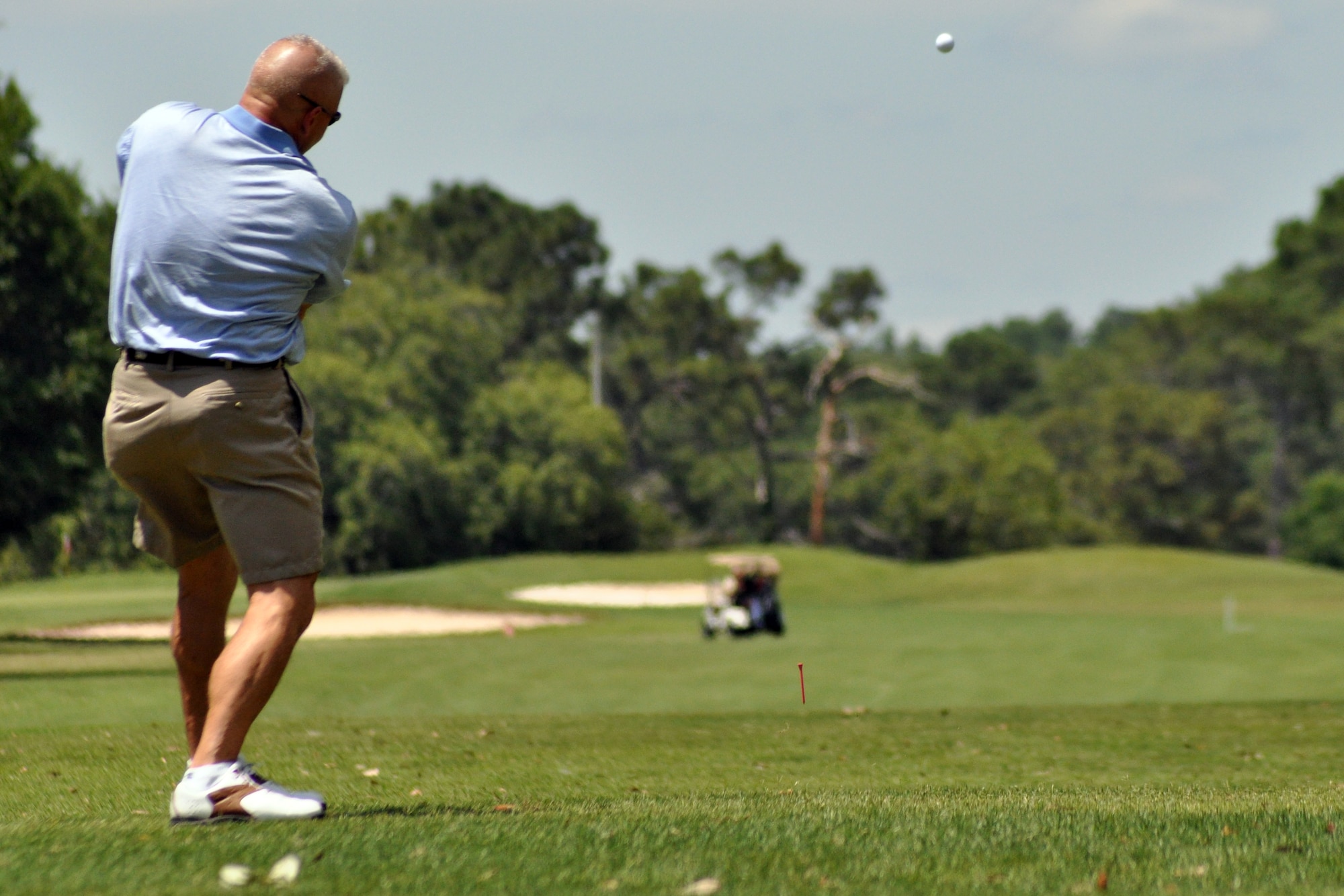 EGLIN AIR FORCE BASE, Fla. – Chief Master Sgt. Mark Nicklas, 46th Maintenance Group superintendant, tees off during a golf tournament at the Eglin Golf Course May 29. The tournament was a fundraiser to support the Hearts Apart Dining program, a program that offers free dining to the families of deployed servicemembers. The goal for the event, led by the First Sergeant’s Council, was to raise $4,000 with 100 percent of the proceeds going to the program. More than 115 people participated in the tournament. (U.S. Air Force photo/ Airman Anthony Jennings)