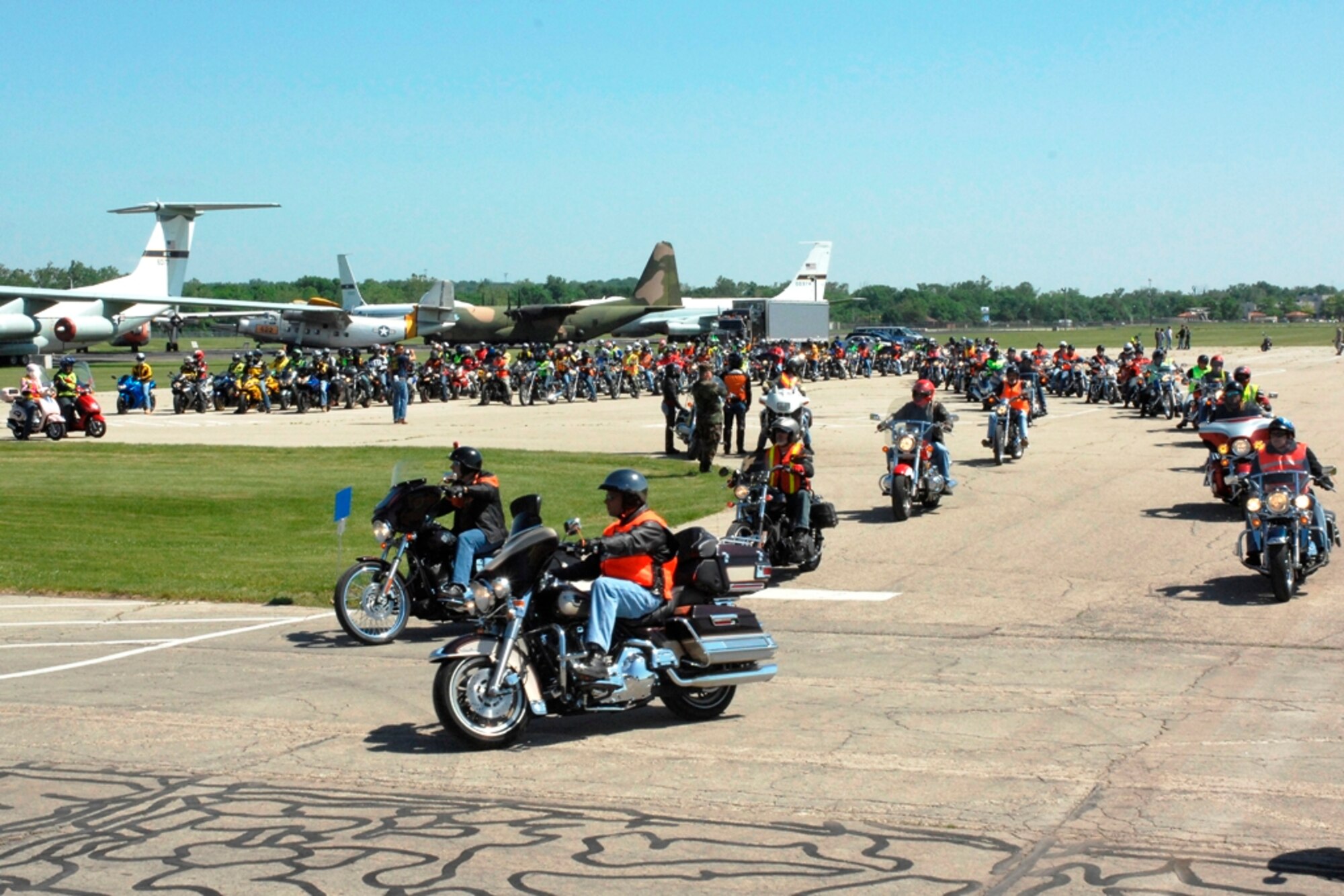Over 200 motorcycles hit the streets of Wright-Patterson Air Force Base in a group ride during the 5th Annual Spring Motorcycle Event held May 29.  The event aimed to inform all base motorcycle riders on safe driving habits.  The event featured safety briefs from the safety office, the Motorcycle Safety Foundation and the California Superbike School.  The event also featured attractions such as trials bike shows, a wheelie machine, stunt shows and a motorcycle dyno. (United States Air Force Photo/Bill Pugh)
