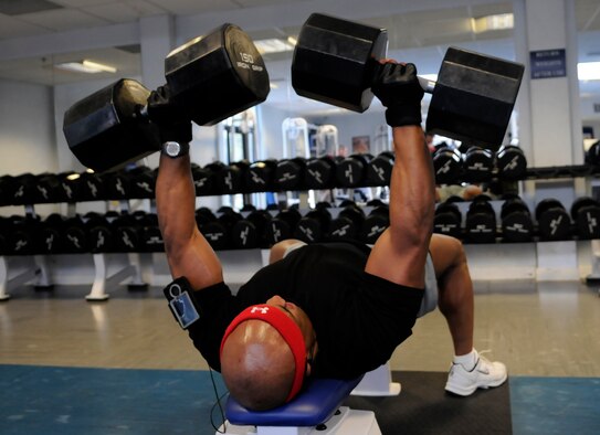 Ryan Greer, an Air Force dependant, puts up a startling 300 lbs worth of dumb bells at the Lakenheath fitness center May 19.  Heavy workouts are part of Mr. Greer's training program as an amateur body builder.  (U.S. Air Force photo by Staff Sgt. Christopher L. Ingersoll)