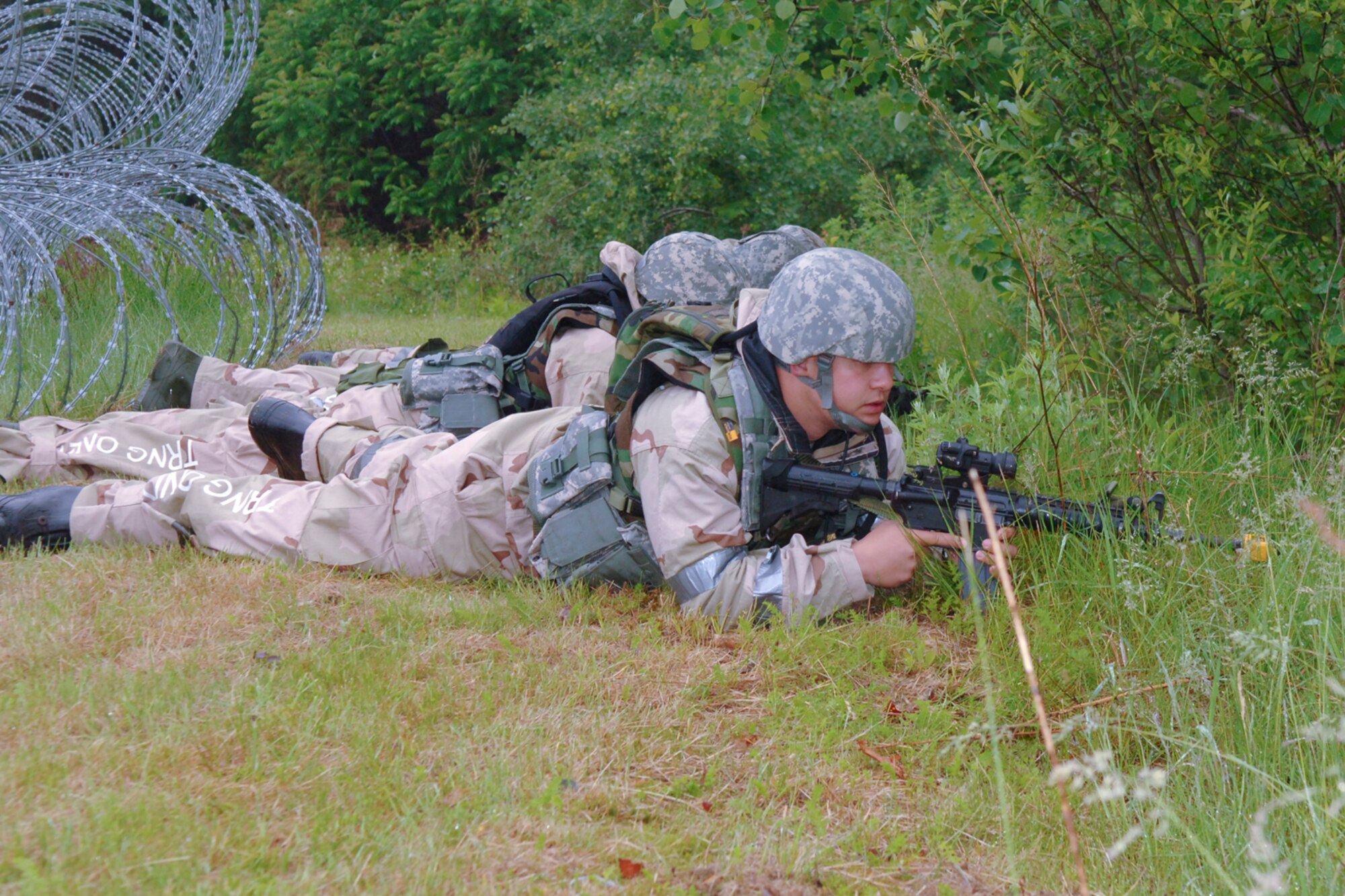 HANSCOM AIR FORCE BASE, Mass. –Airmen take up defensive positions while searching for an enemy combatant following a simulated attack at Camp Patriot during the May 26 to 29 Base Readiness Exercise. (U.S. Air Force photo by Rick Berry) 

