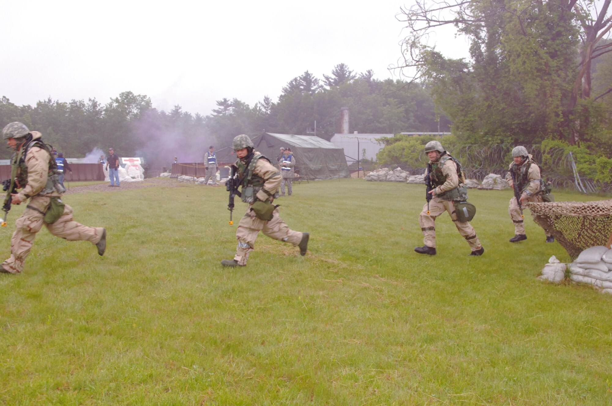 HANSCOM AIR FORCE BASE, Mass. –Members of the 66th Security Forces Squadron respond to a simulated attack at Camp Patriot during the May 26 to 29 Base Readiness Exercise.  (U.S. Air Force photo by Rick Berry)