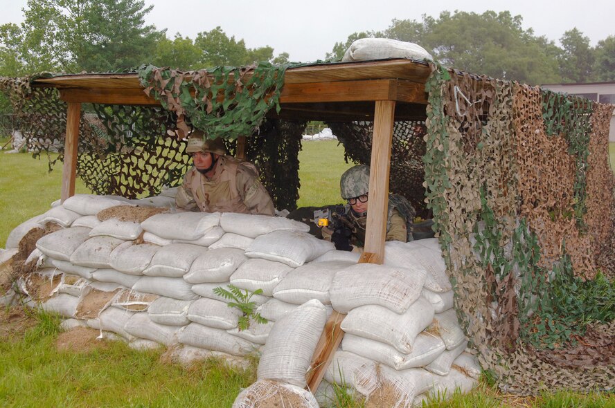HANSCOM AFB, Mass. – Hanscom servicemembers stay alert while taking defensive measures following a simulated attack at Camp Patriot during the Base Readiness Exercise that took place from May 26 to 29.  (U.S. Air Force photo by Rick Berry)