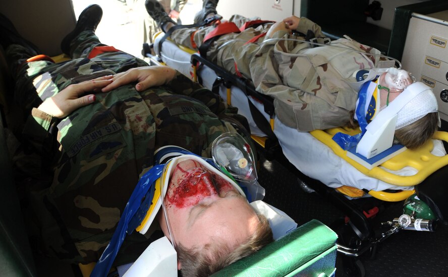 "Victims" Victoria Alpert, left, and Maj. Michael S. Rutigliano, lay on stretchers in a Westhampton Beach Ambulance after being taken out of their SUV which was part of the mock auto accident demonstration on May 20, 2009. The demonstration was part of the 101 Critical Days of Summer.

(U.S. Air Force Photo/Staff Sgt. David J. Murphy)
