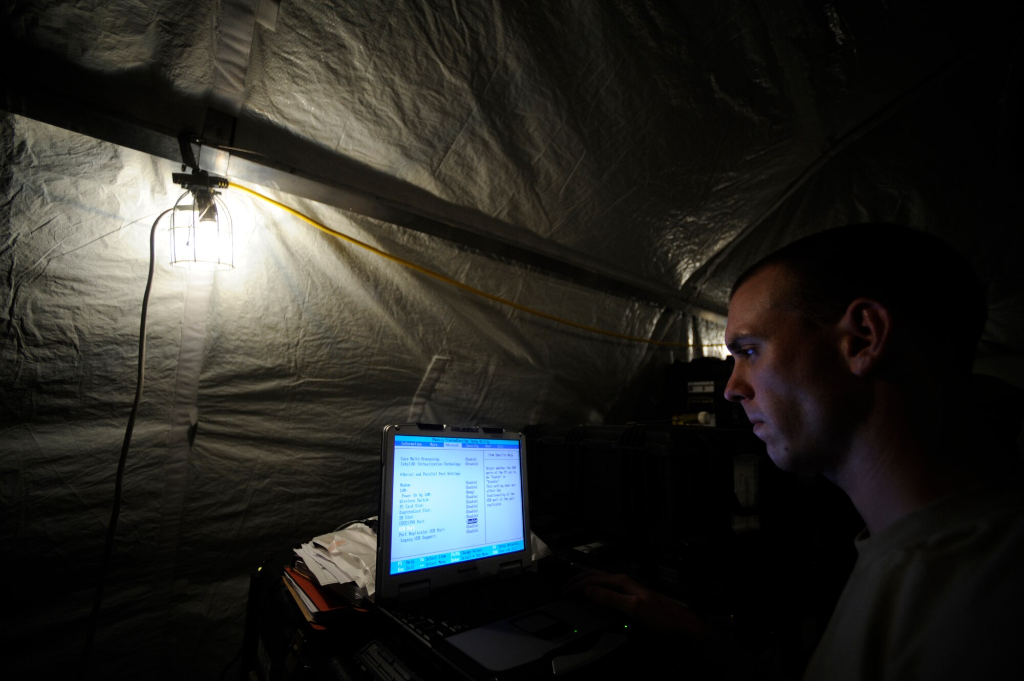 U.S. Air Force Senior Airman Bret Ward, network administrator, 72nd Expeditionary Air Control Squadron, 451st Air Expeditionary Group, Kandahar Air Field, Afghanistan, images a computer for use on the network on May 17, 2009, in support of Operation Enduring Freedom. The Air Control Squadron is being built from the ground up to replace an outdated system being used currently at Kandahar Air Field.  (U.S. Air Force photo by Staff Sgt. James L. Harper Jr.)Released