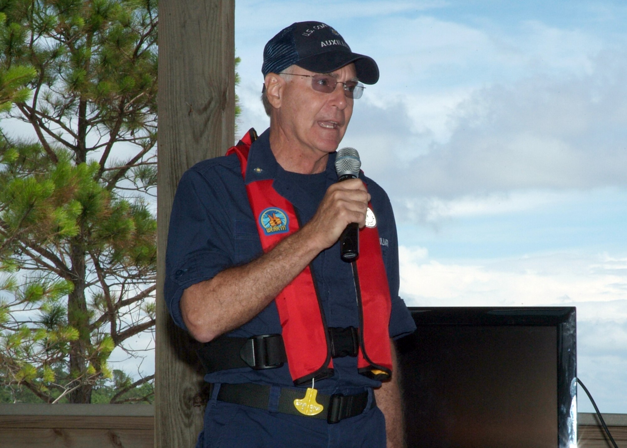 Coast Guard Auxilliarist Bill Petritz from CG Station Destin, Fla., discusses boating safety at the 505th Command and Control Wing’s  Safety Day event at the Hurlburt Field marina.