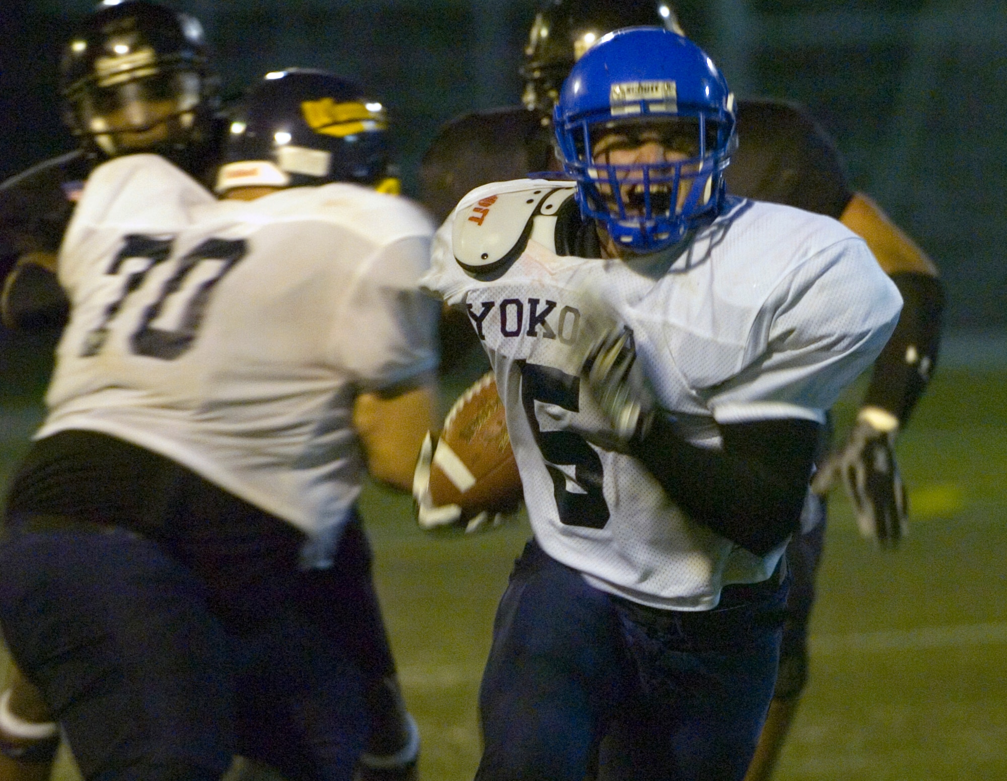 YOKOSUKA NAVAL BASE, Japan -- Yokota Warriors' running back Kevin Fortin grimaces in pain as he suffers from a cramp in his calf during Yokosuka's 41-12 win over the Warriors May 30 in U.S. Forces Japan-American Football League action. The Seahawks improved to 3-0 on the season, while Yokota fell to 0-3. The Warriors' final two home games at Bonk Field are set for 5 p.m. June 6 vs. Misawa and 4 p.m. June 27 vs. Kadena. (U.S. Air Force photo/Master Sgt. Matt Summers)