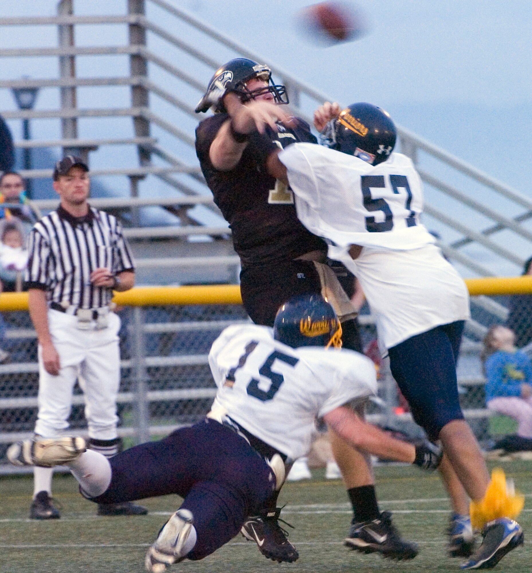 YOKOSUKA NAVAL BASE, Japan -- Yokota defenders Luke Boggs (No. 15) and Jamal McCall pressure Yokosuka quarterback Bob Docherty into an errant throw during the Seahawks' 41-12 win over the Warriors May 30 in U.S. Forces Japan-American Football League action. Docherty and Anthony Seaman combined for three touchdown passes on the night. The Warriors' final two home games at Bonk Field are set for 5 p.m. June 6 vs. Misawa and 4 p.m. June 27 vs. Kadena. (U.S. Air Force photo/Master Sgt. Matt Summers)